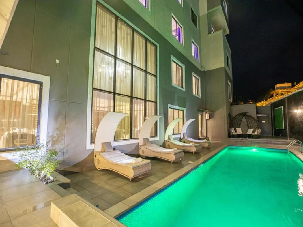 Swimming pool in Tripod By Pedestal Hotel