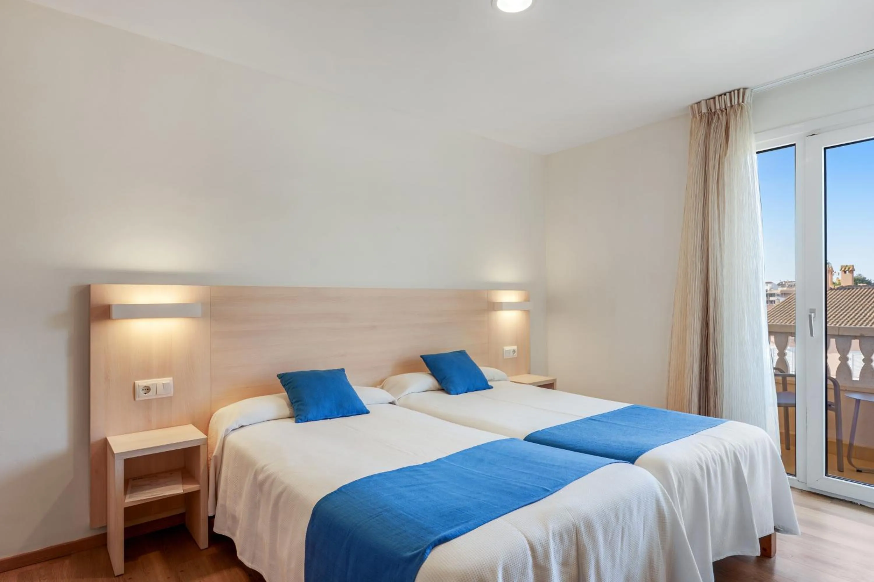 Bed in Bluewater Hotel