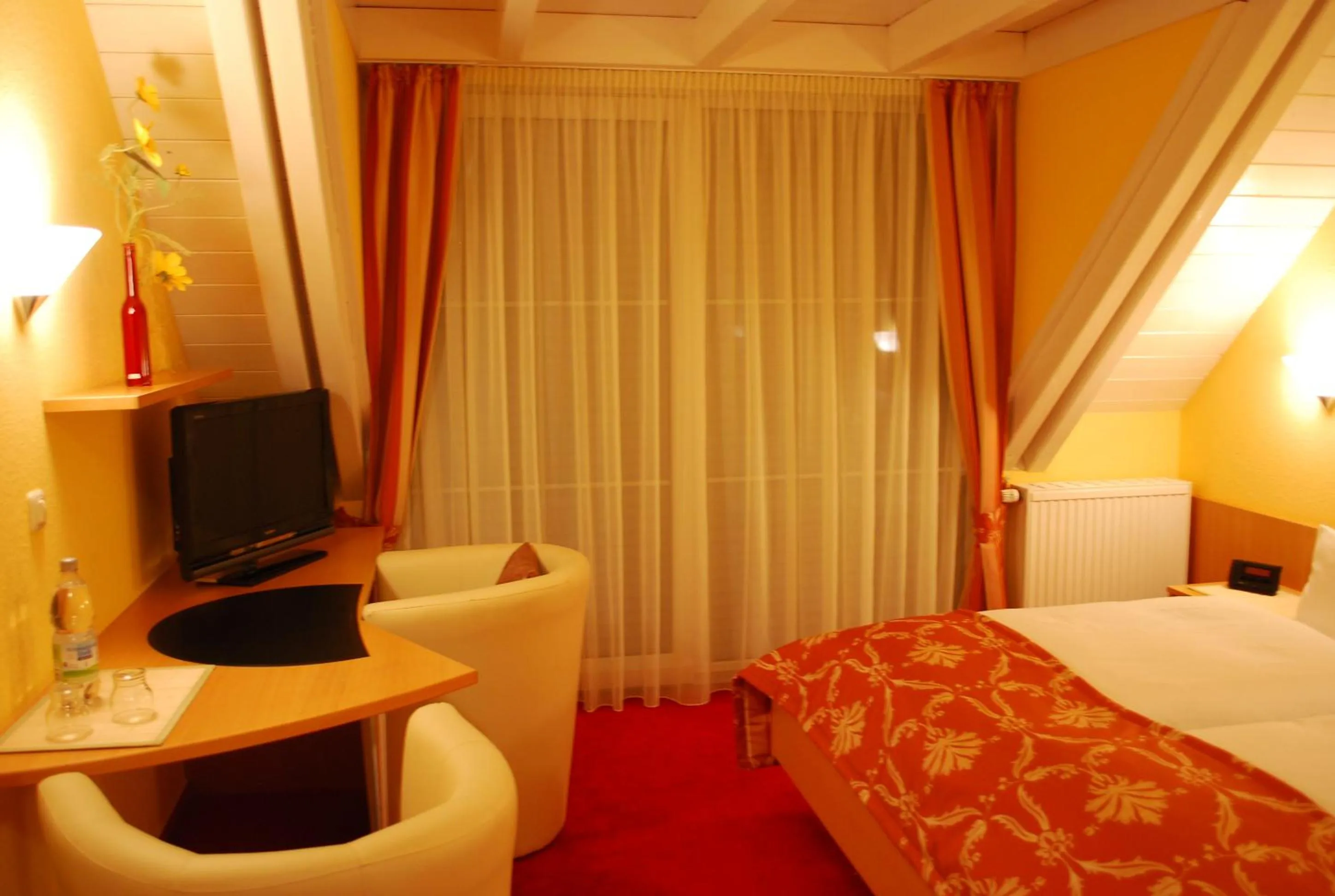 Seating area, Bed in Im Winkel Appartements und Zimmer