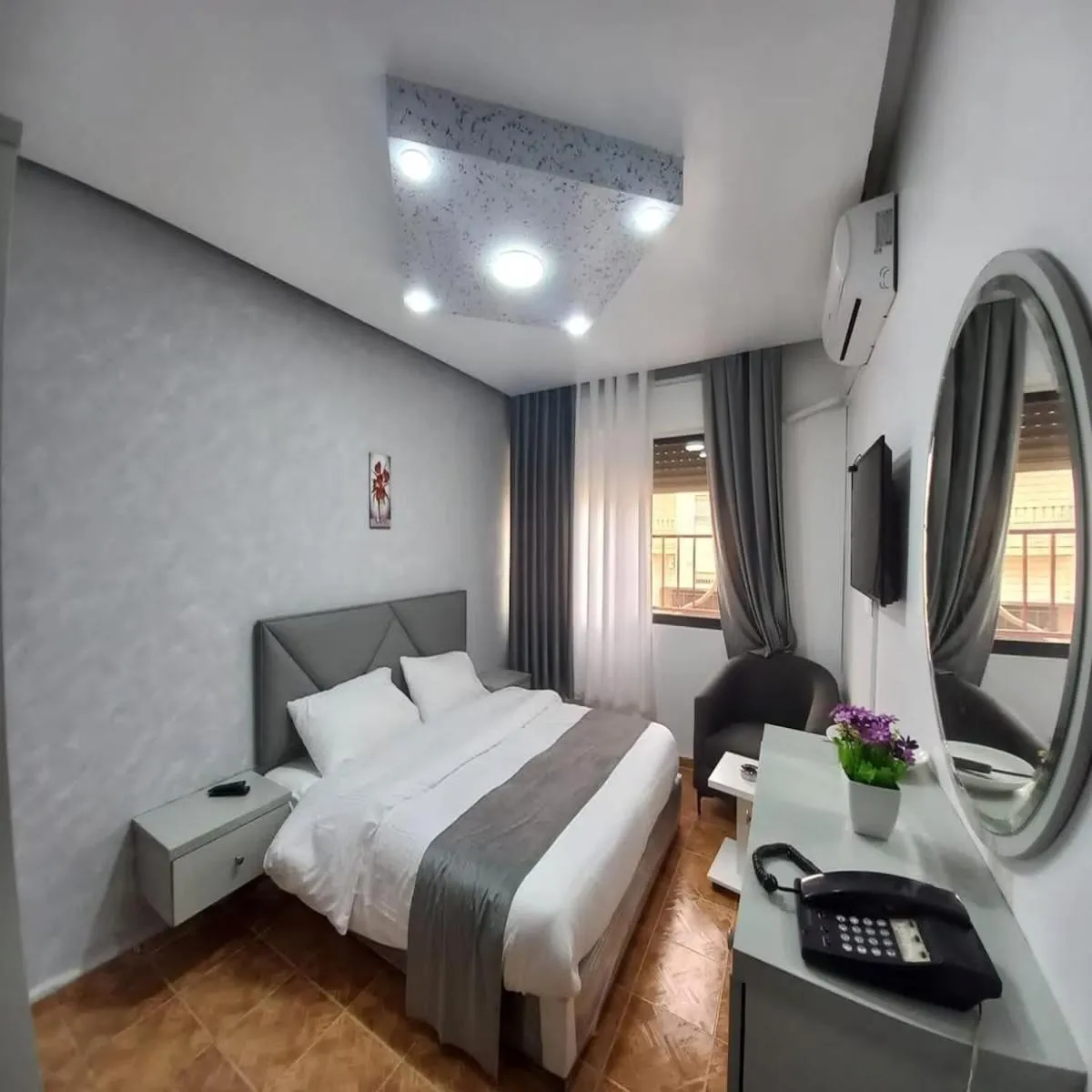 Bed in Al-Nujoom Hotel Suites