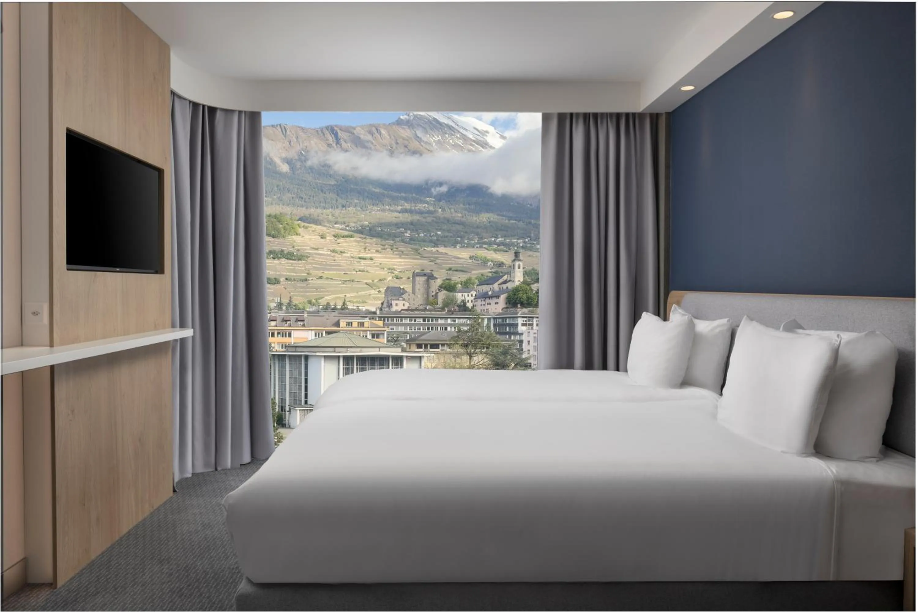 Bed in Holiday Inn Express & Suites Sion by IHG