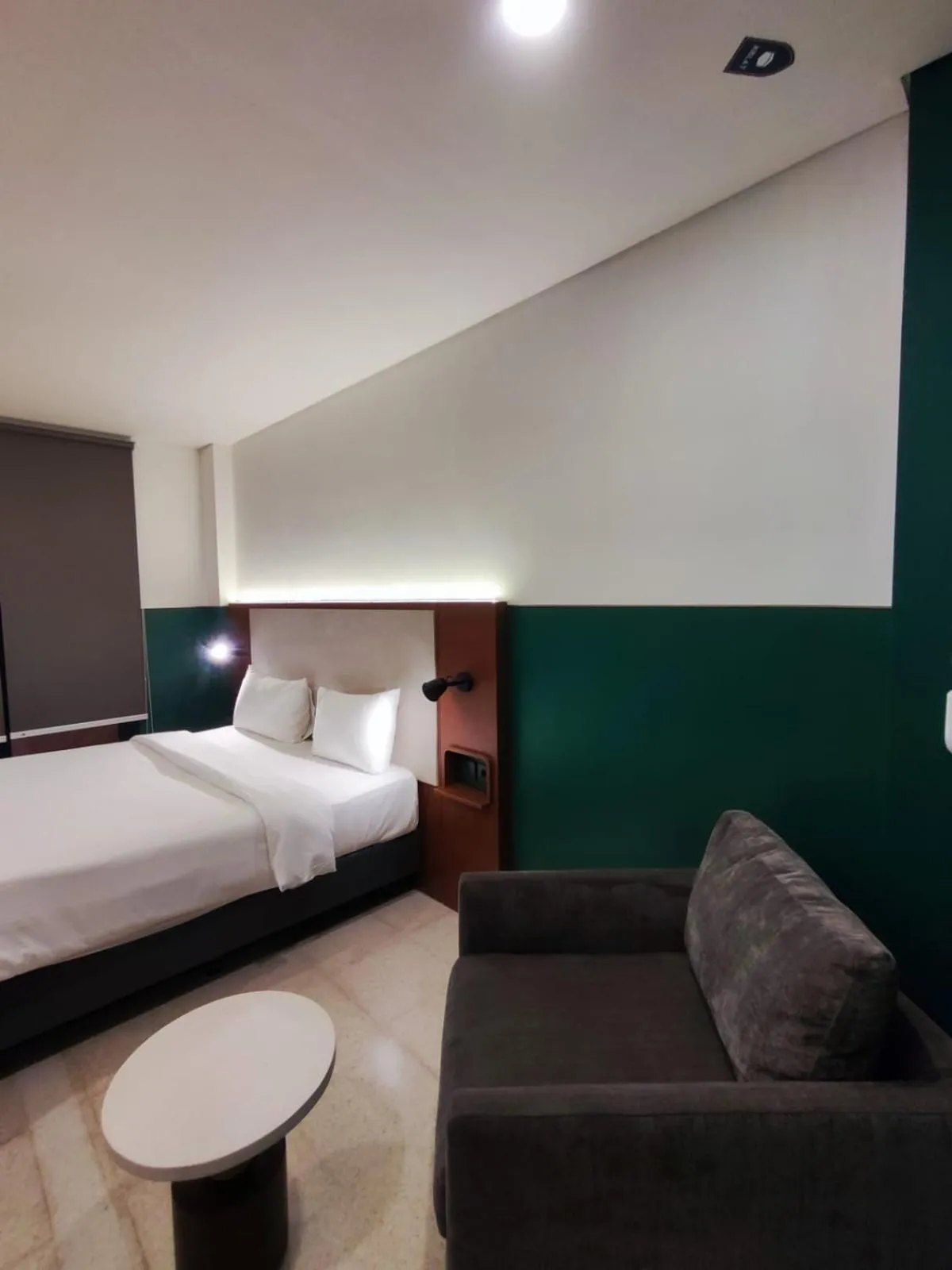 Living room, Bed in Liberta Malioboro North