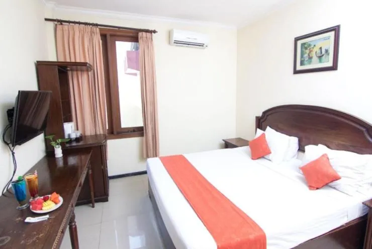 Bedroom in Tuwuh Hotel at Kayutangan