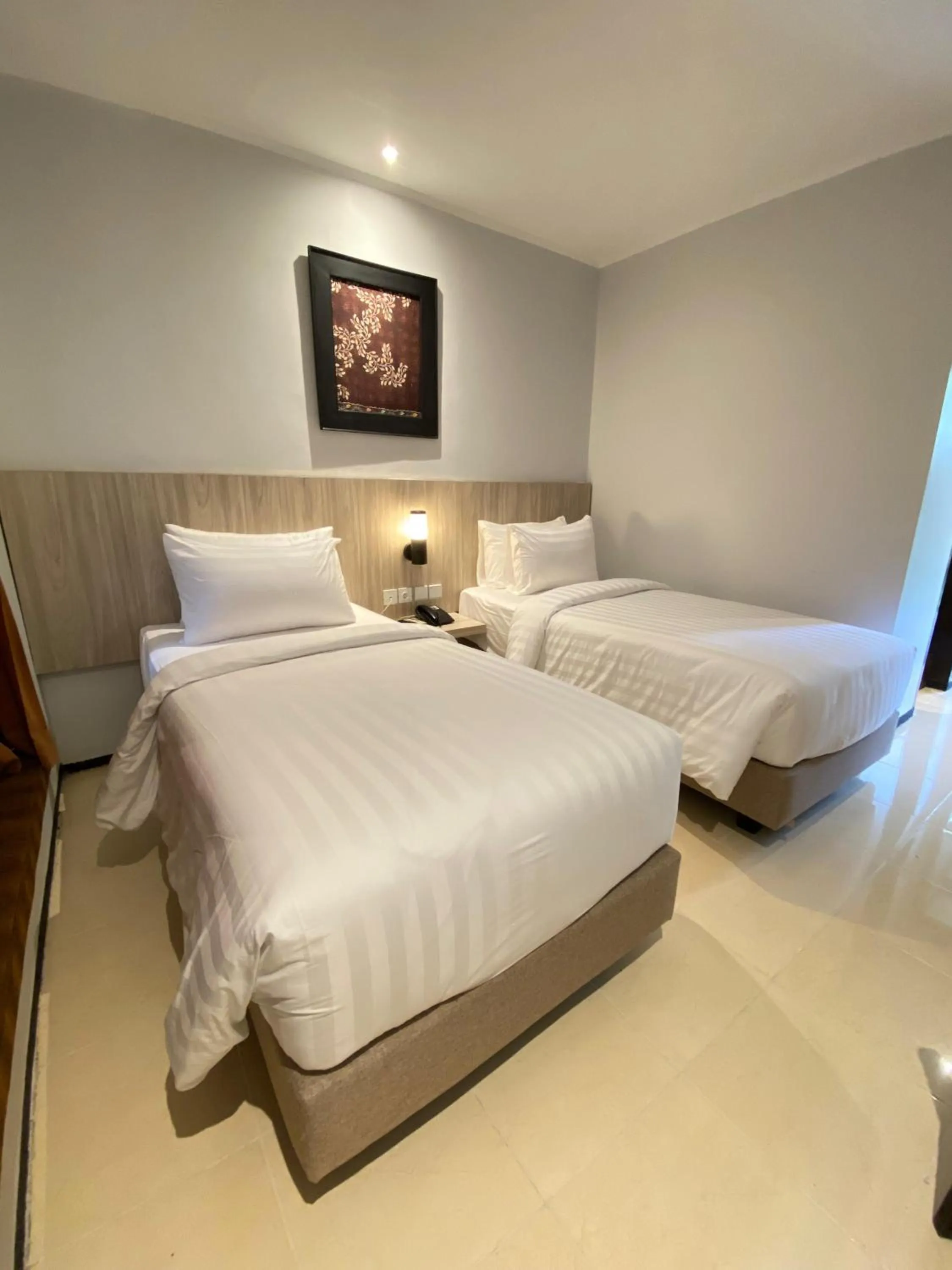 Bedroom in Tuwuh Hotel at Kayutangan