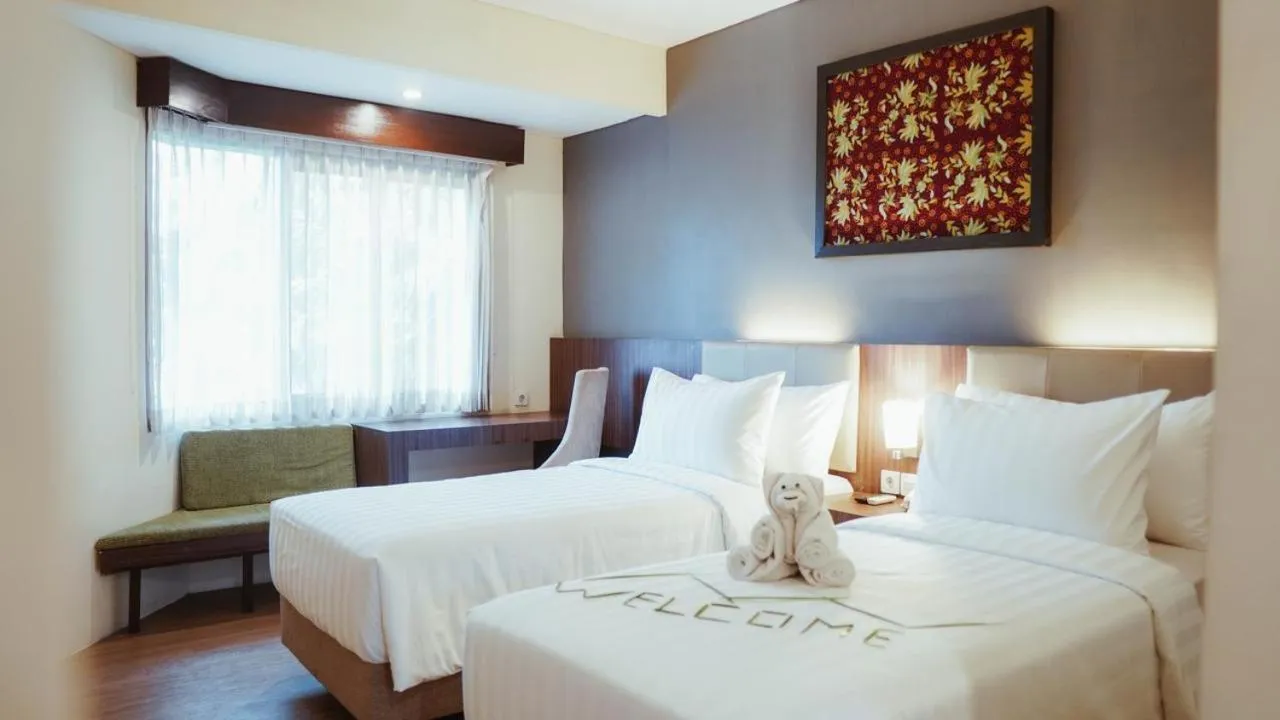 Bedroom in Tuwuh Hotel at Kayutangan