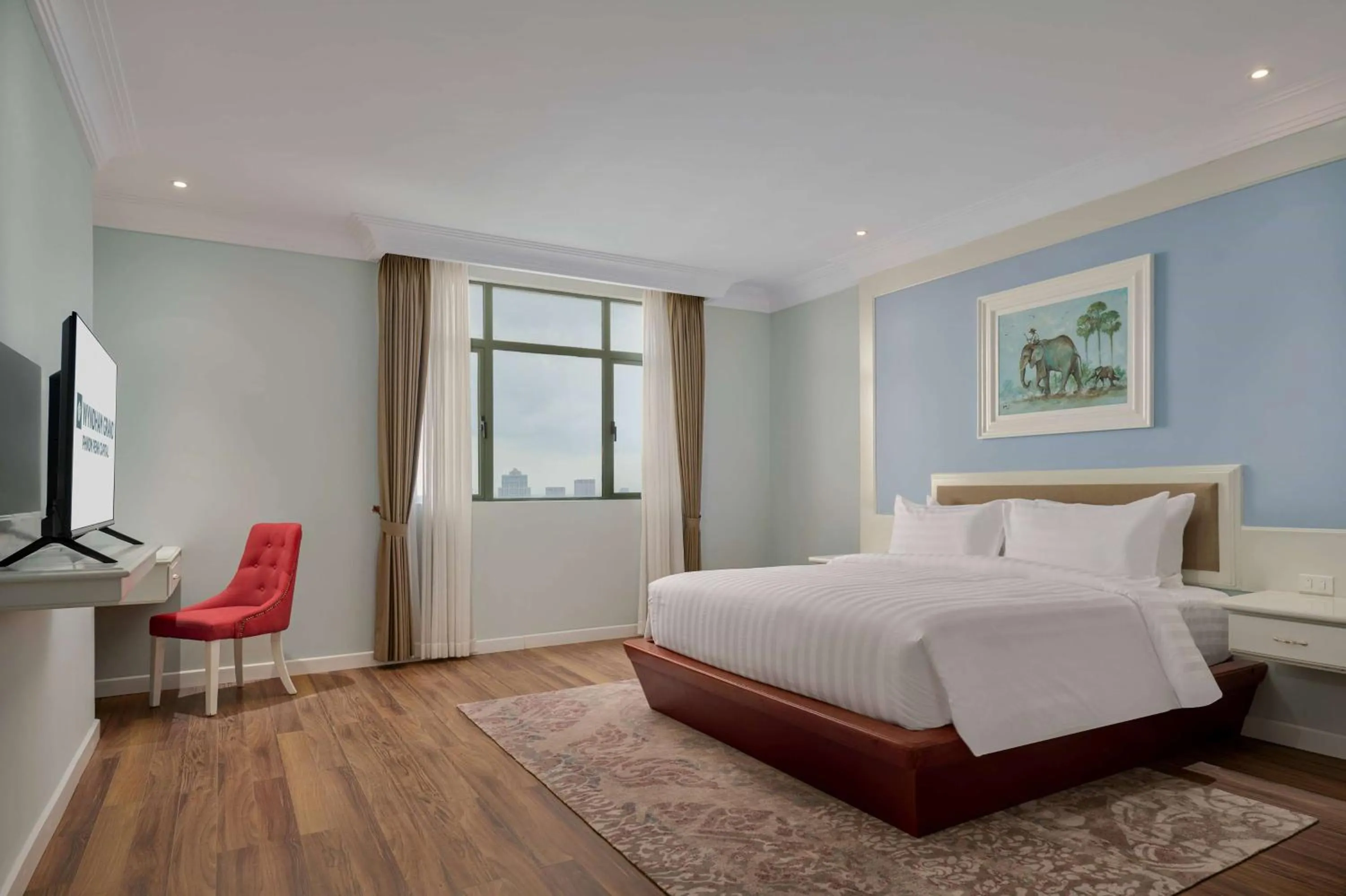 Photo of the whole room, Bed in Wyndham Grand Phnom Penh Capital