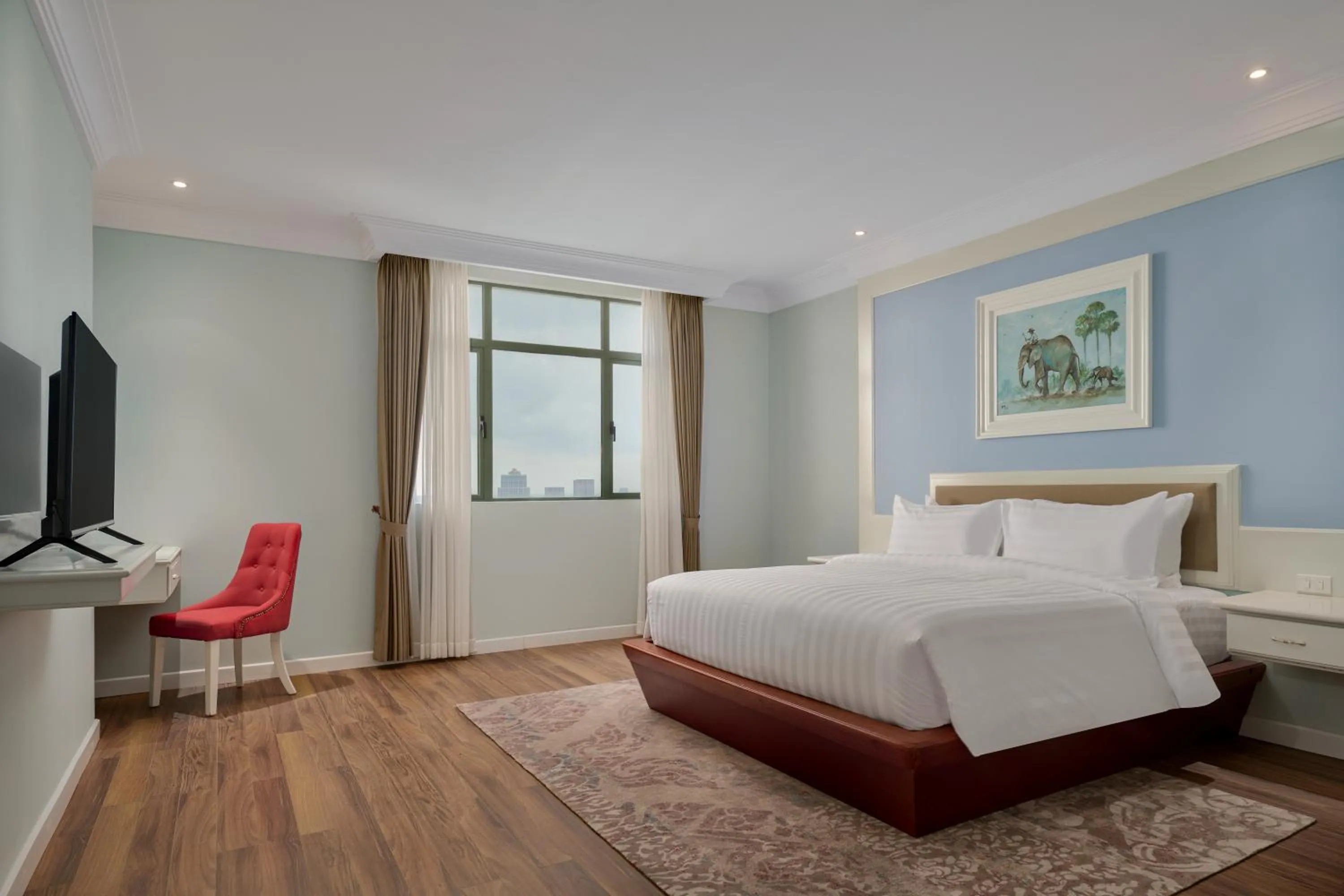 Bed in Wyndham Grand Phnom Penh Capital