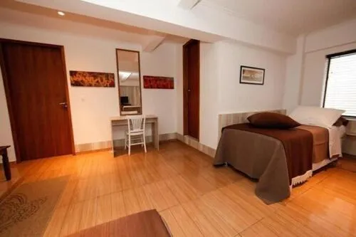 Bed in Iguassu Flats Hotel