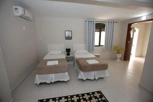 Bed in Iguassu Flats Hotel