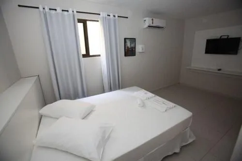 Bed in Iguassu Flats Hotel