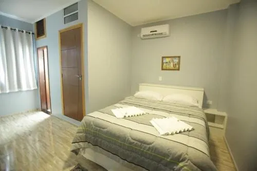 Bed in Iguassu Flats Hotel