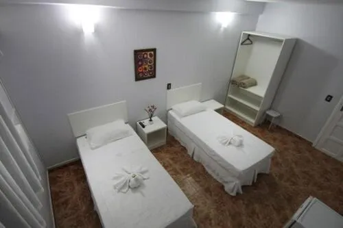 Bed in Iguassu Flats Hotel