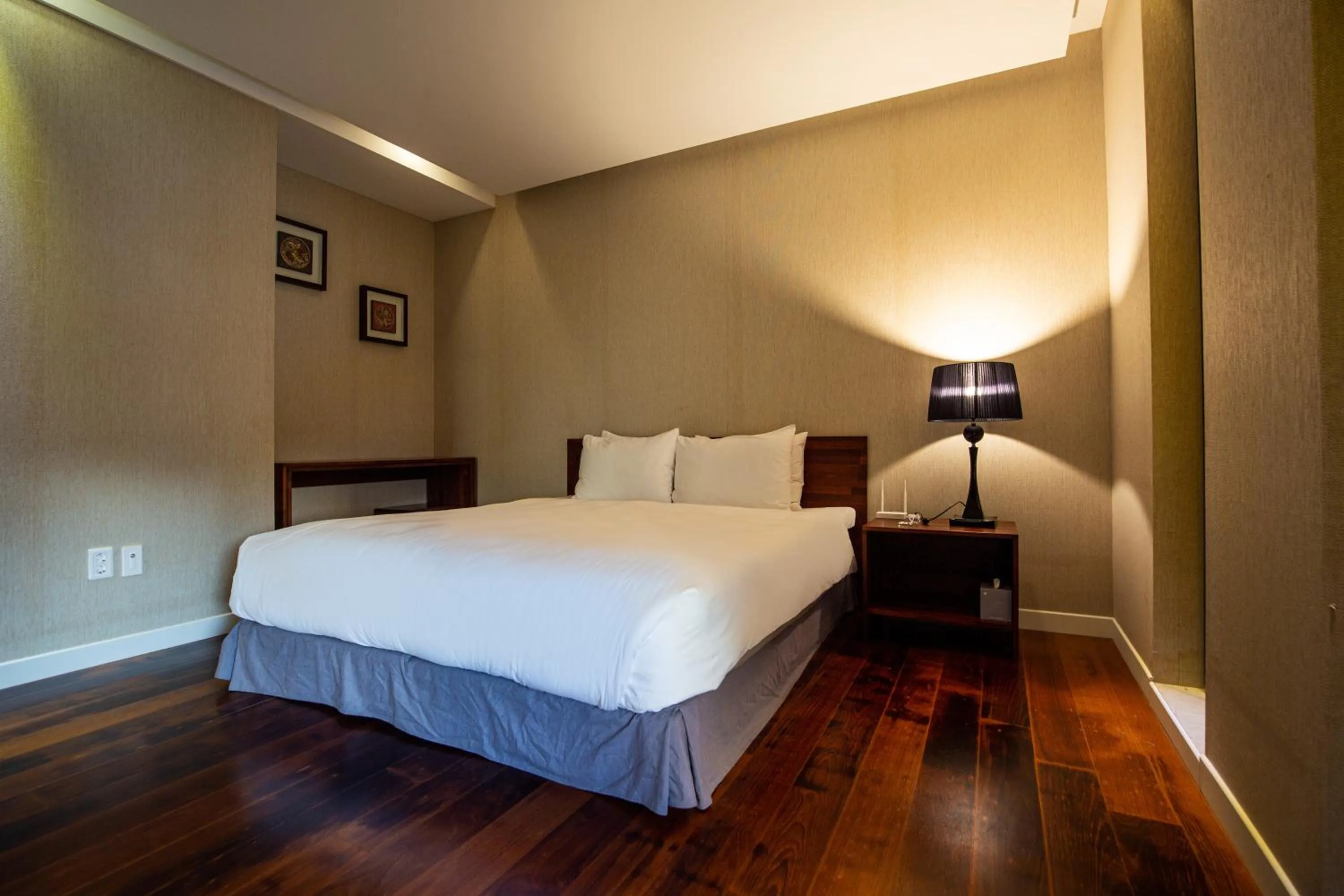 Bed in Libentia Hotel & Poolvilla