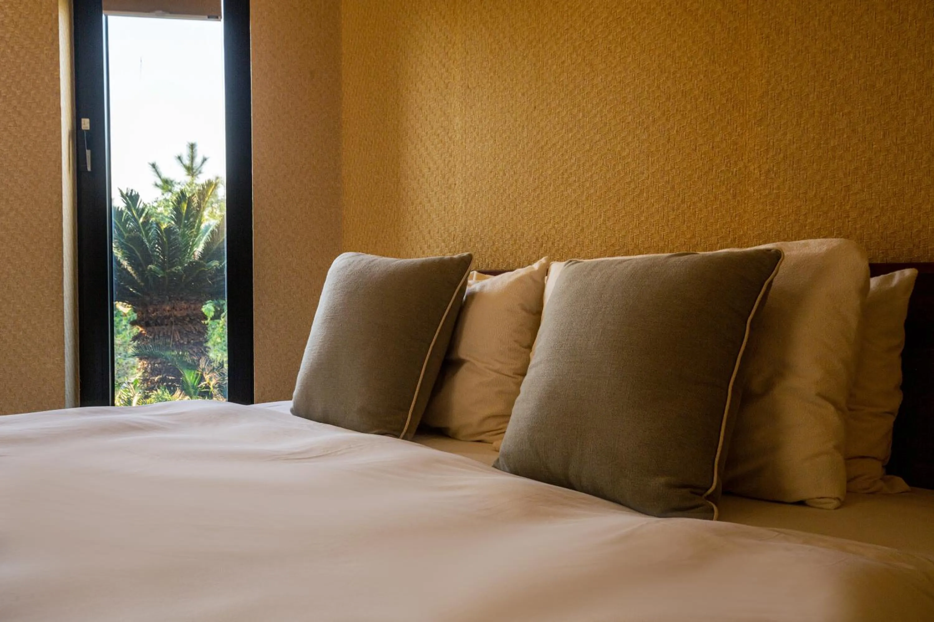 Bed in Libentia Hotel & Poolvilla