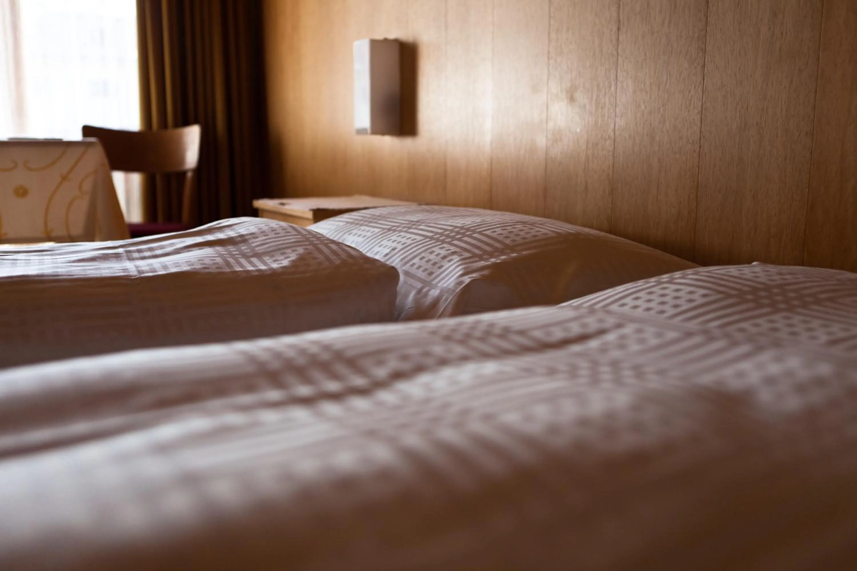 Bed in Hotel Garni Simplon