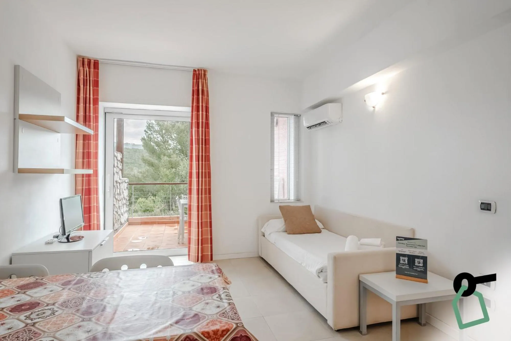 Living room, Bed in Hotiday Apartments Portoferraio