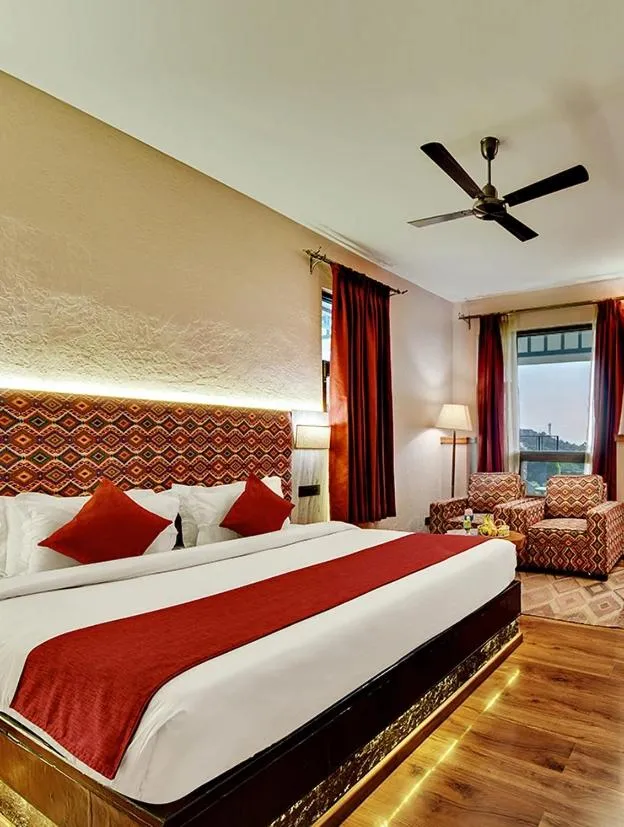 Bed in Tiaraa Jujurana Resort & Spa