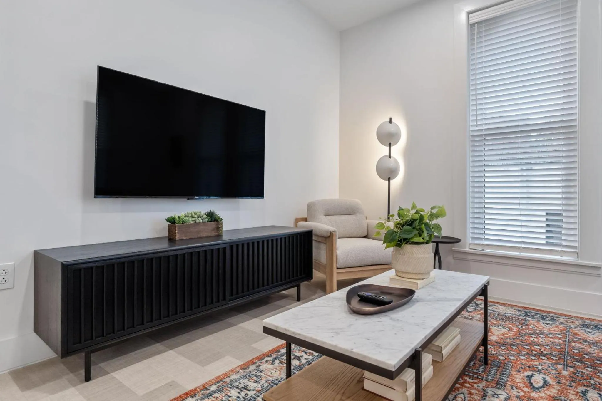 Living room in The Continental, powered by Placemakr - Downtown - Market Square