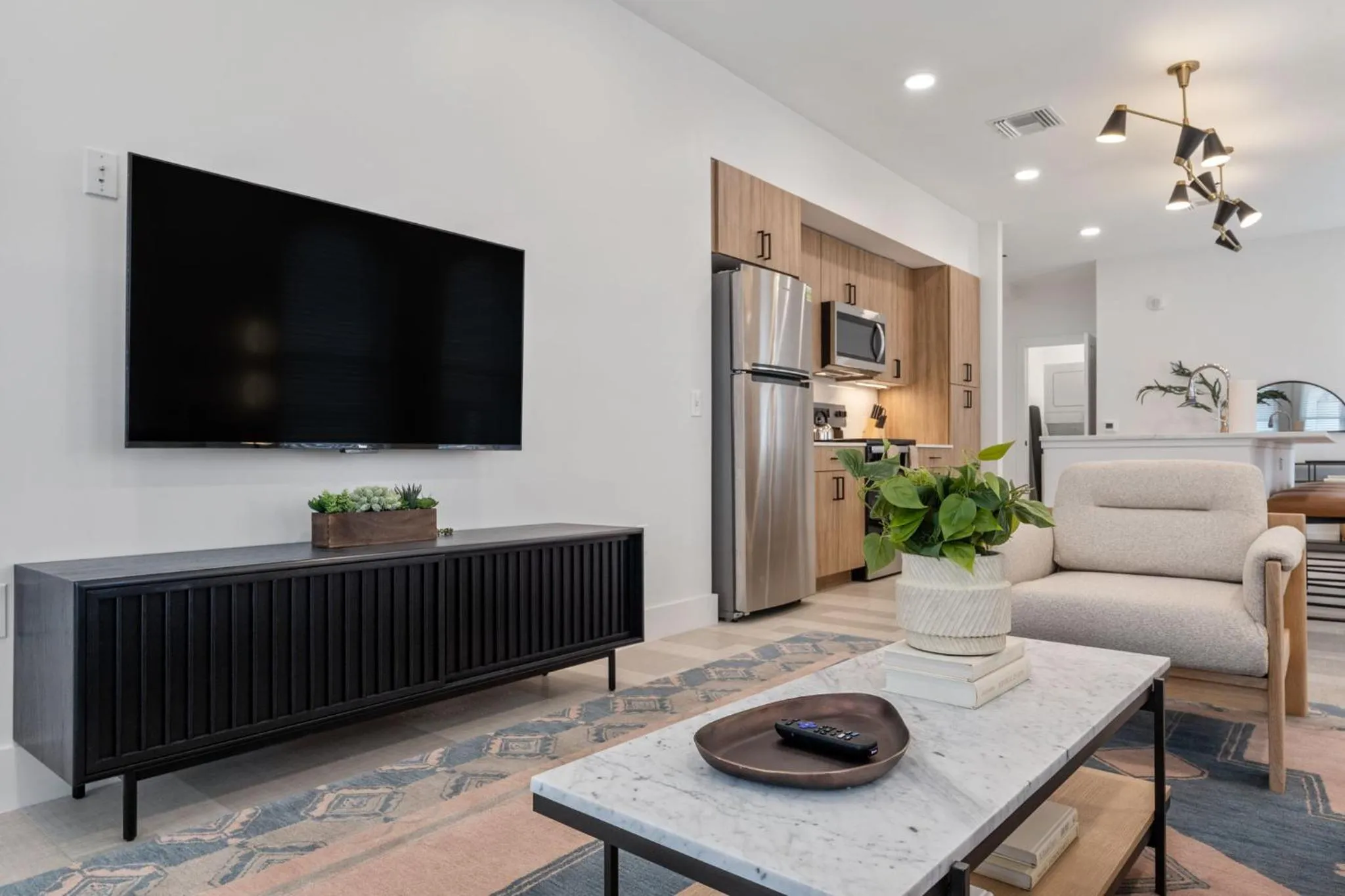 Living room in The Continental, powered by Placemakr - Downtown - Market Square