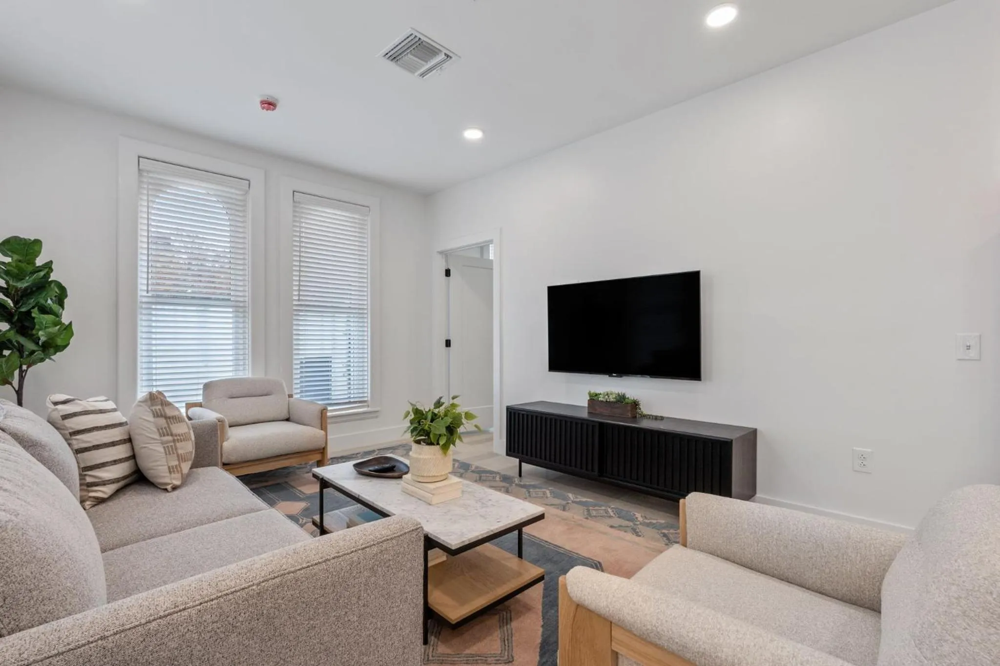 Living room in The Continental, powered by Placemakr - Downtown - Market Square