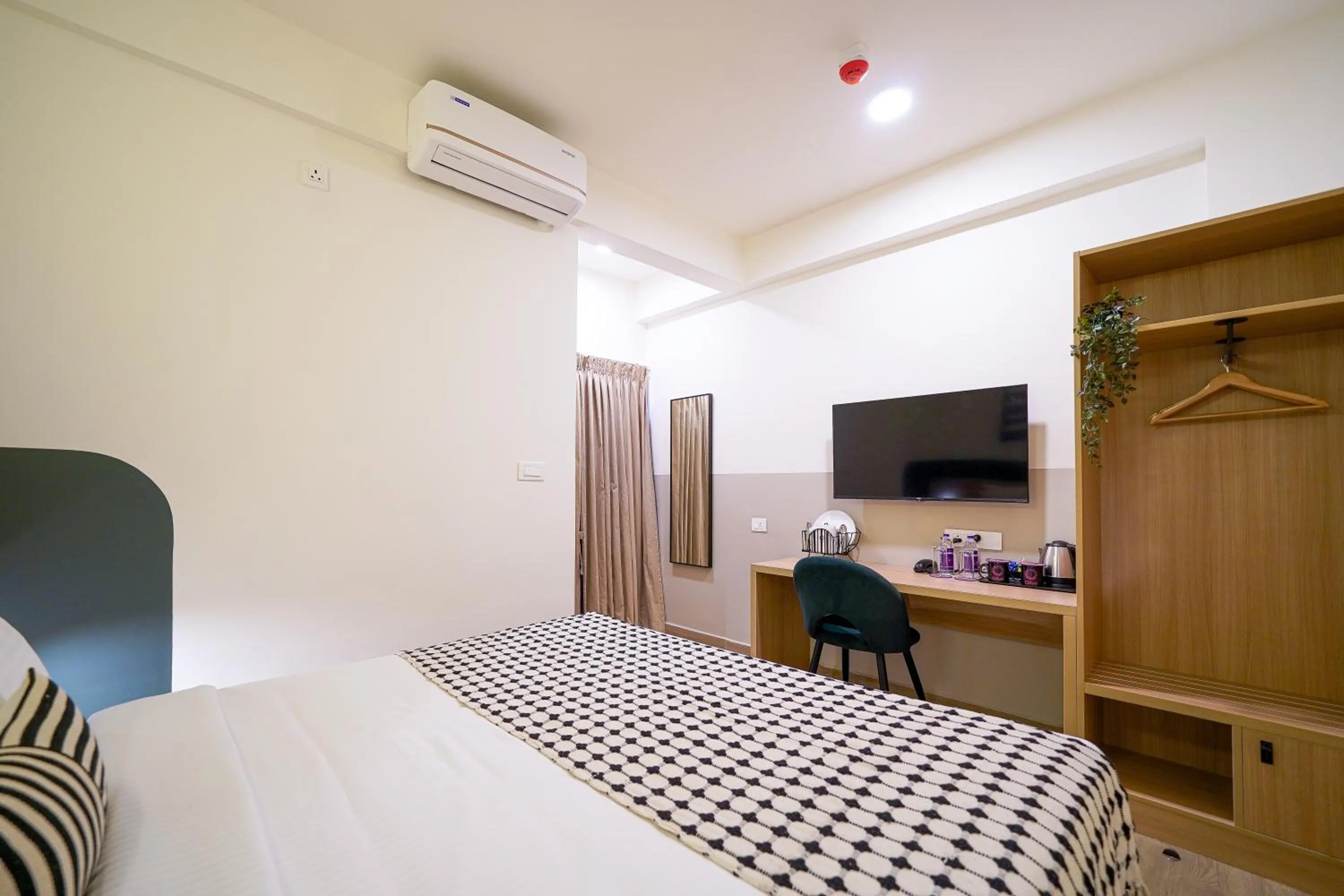 Bed in Olive Hotel Hoodi by Embassy Group