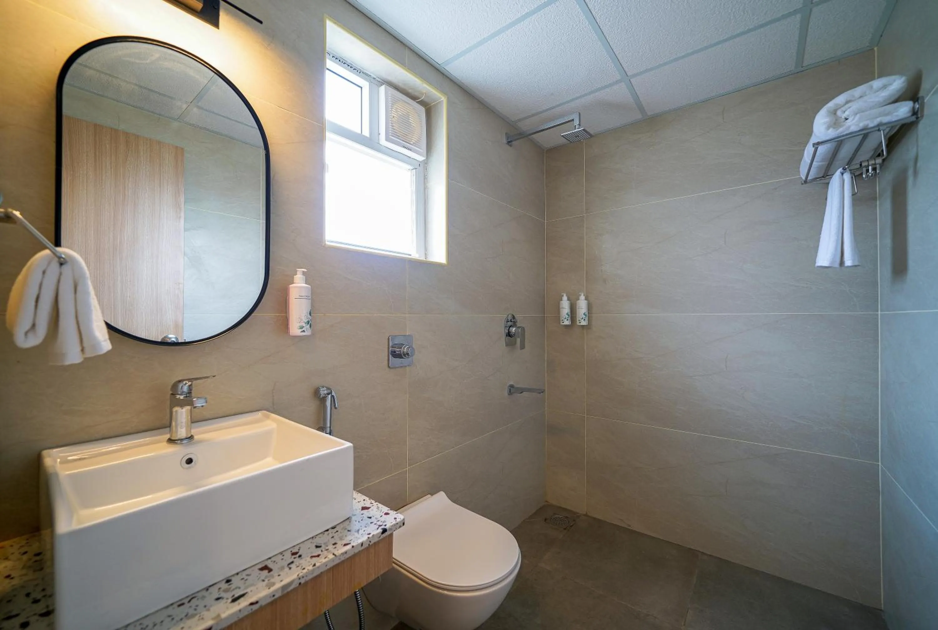 Shower in Olive Hotel Hoodi by Embassy Group