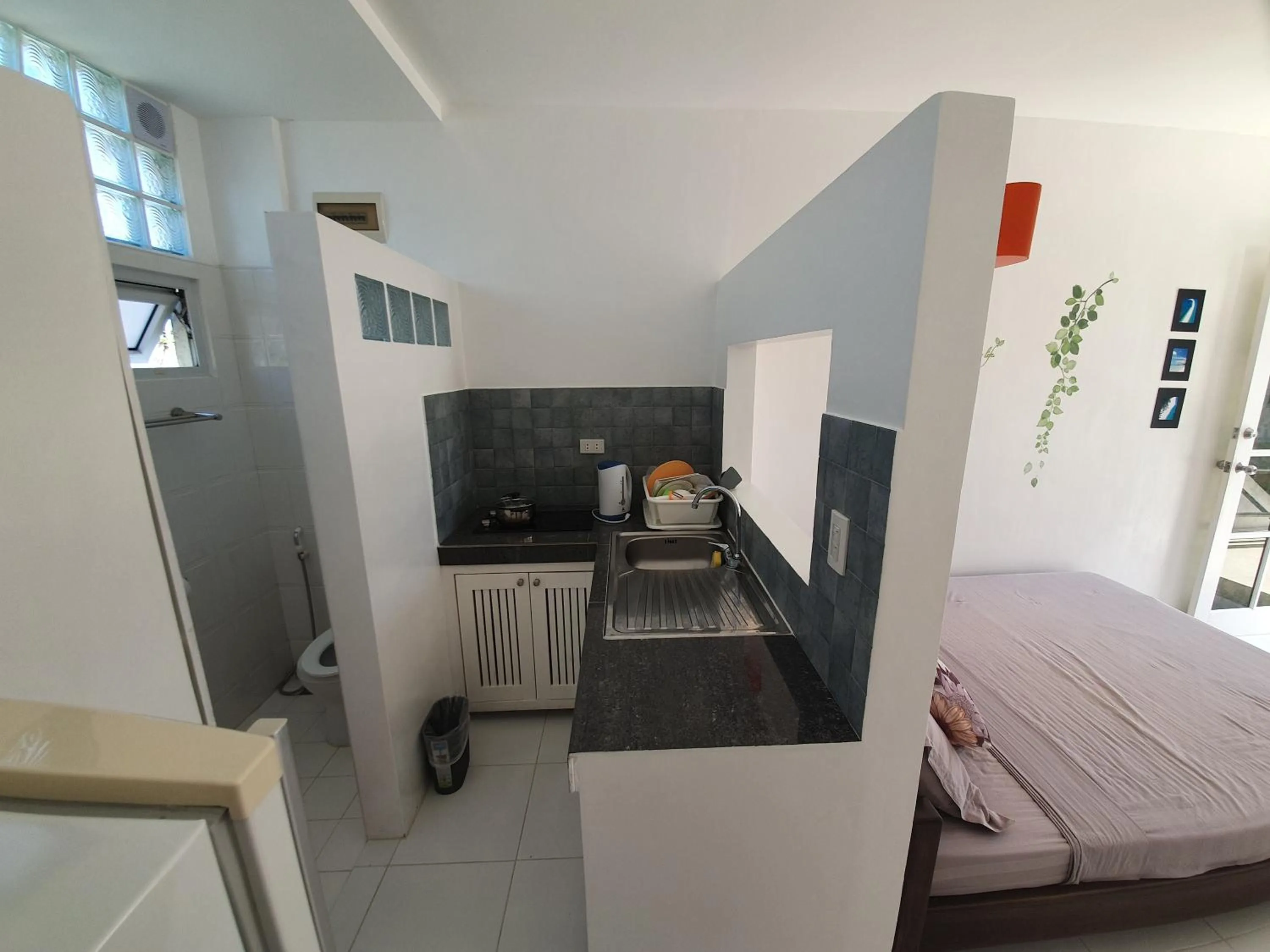 Kitchen or kitchenette, Bed in ClubBoracay Apartelle