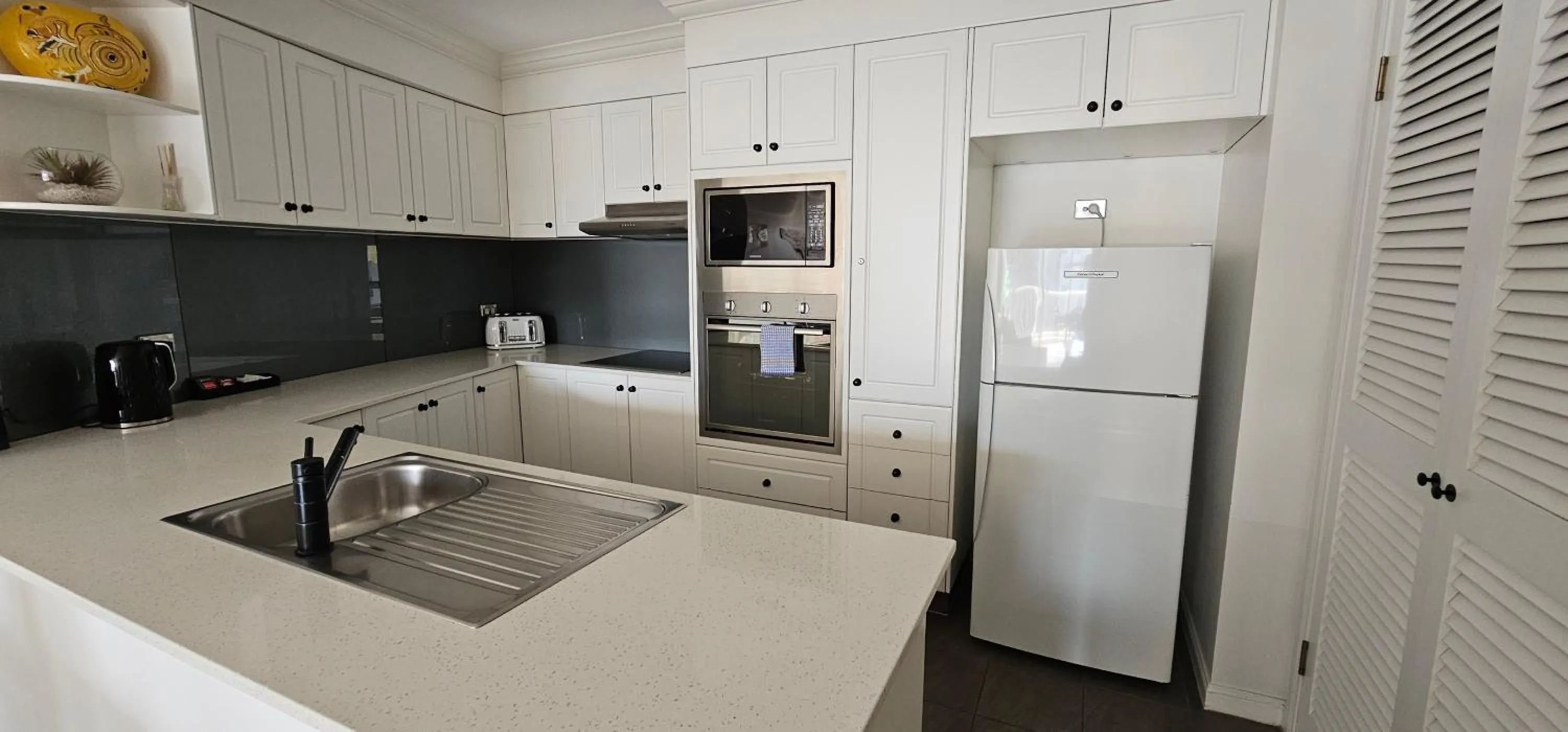 kitchen in Broadbeach Holiday Apartments