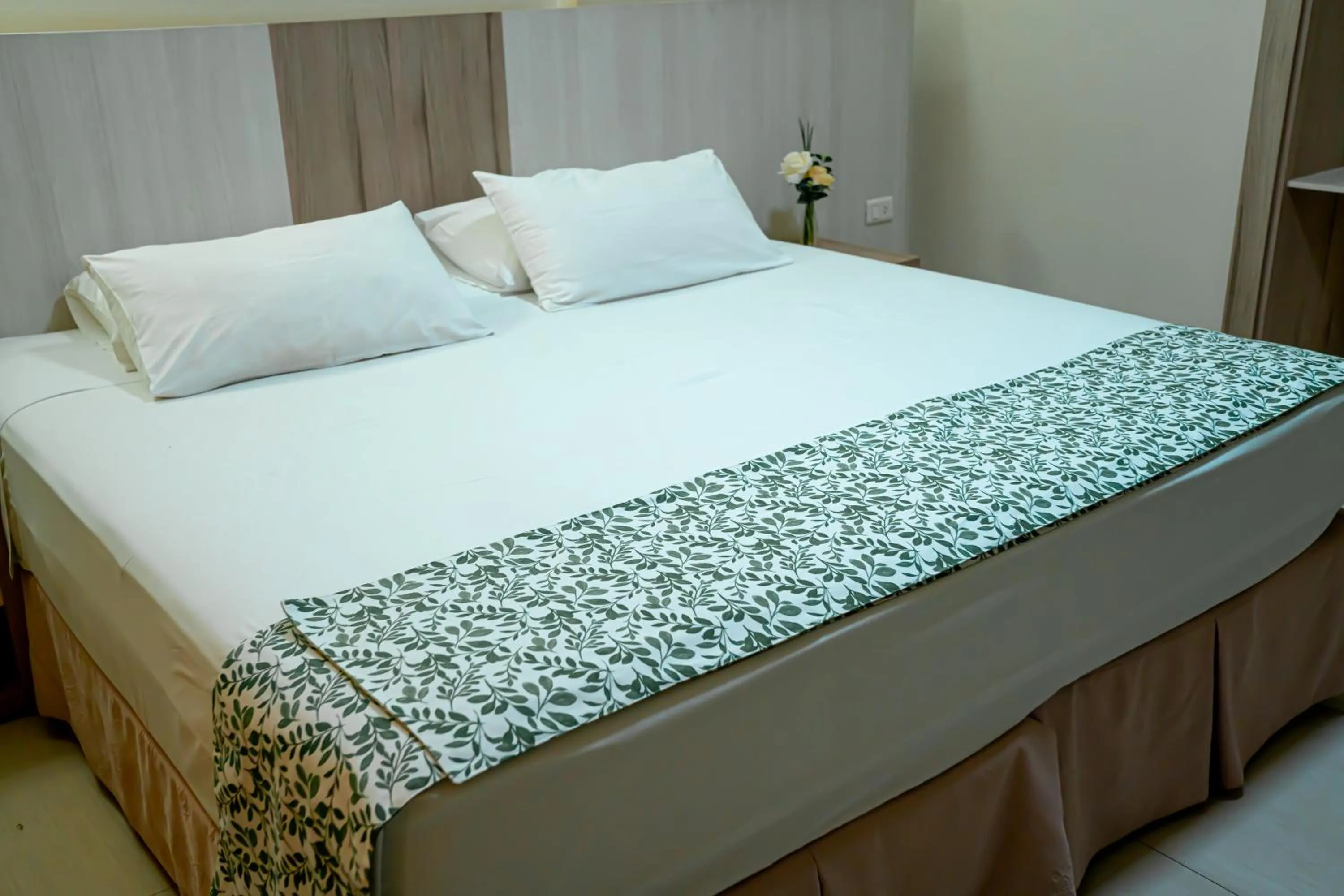 Bed in Megal Suites Hotel