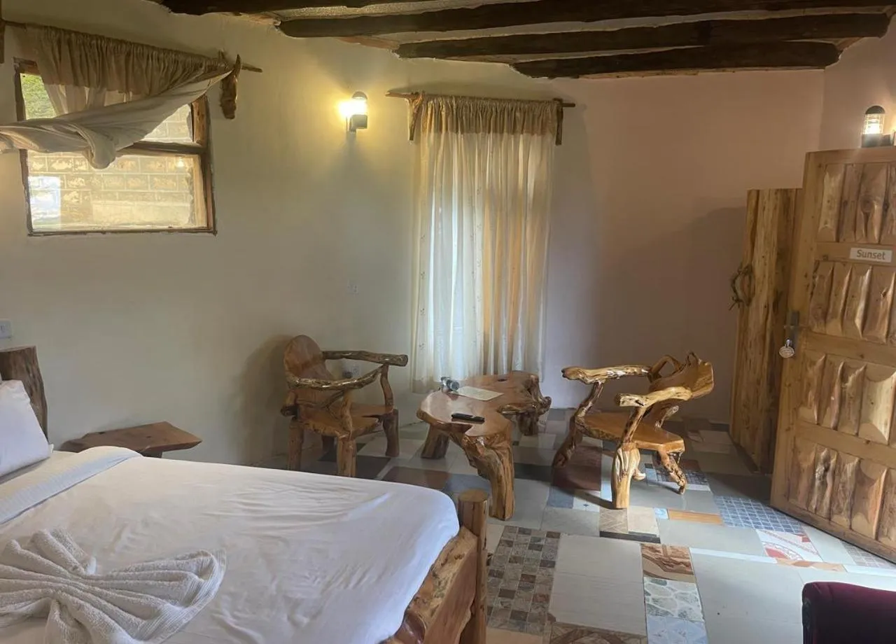 Seating area, Bed in Enkapune Resort Naivasha