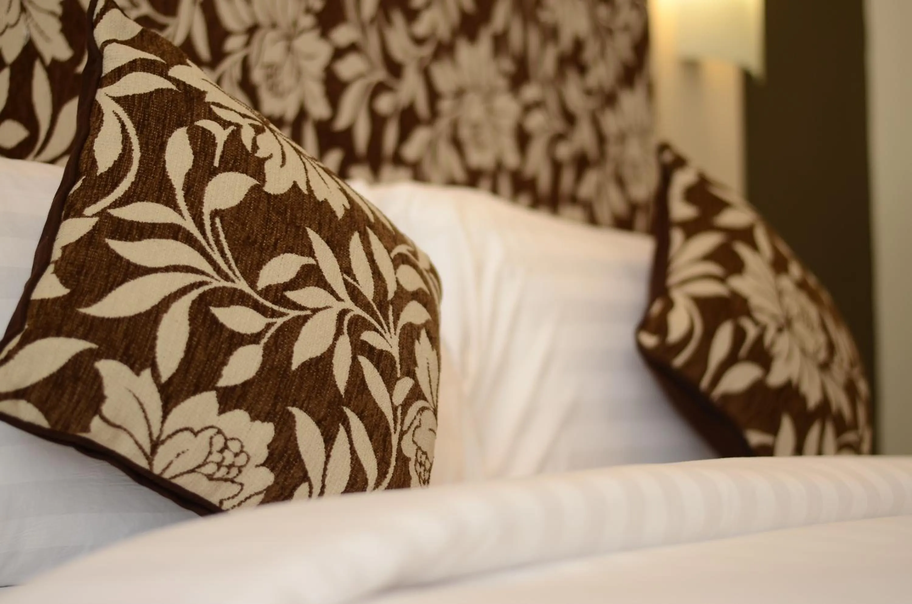 Bed in Quest San Denpasar by ASTON