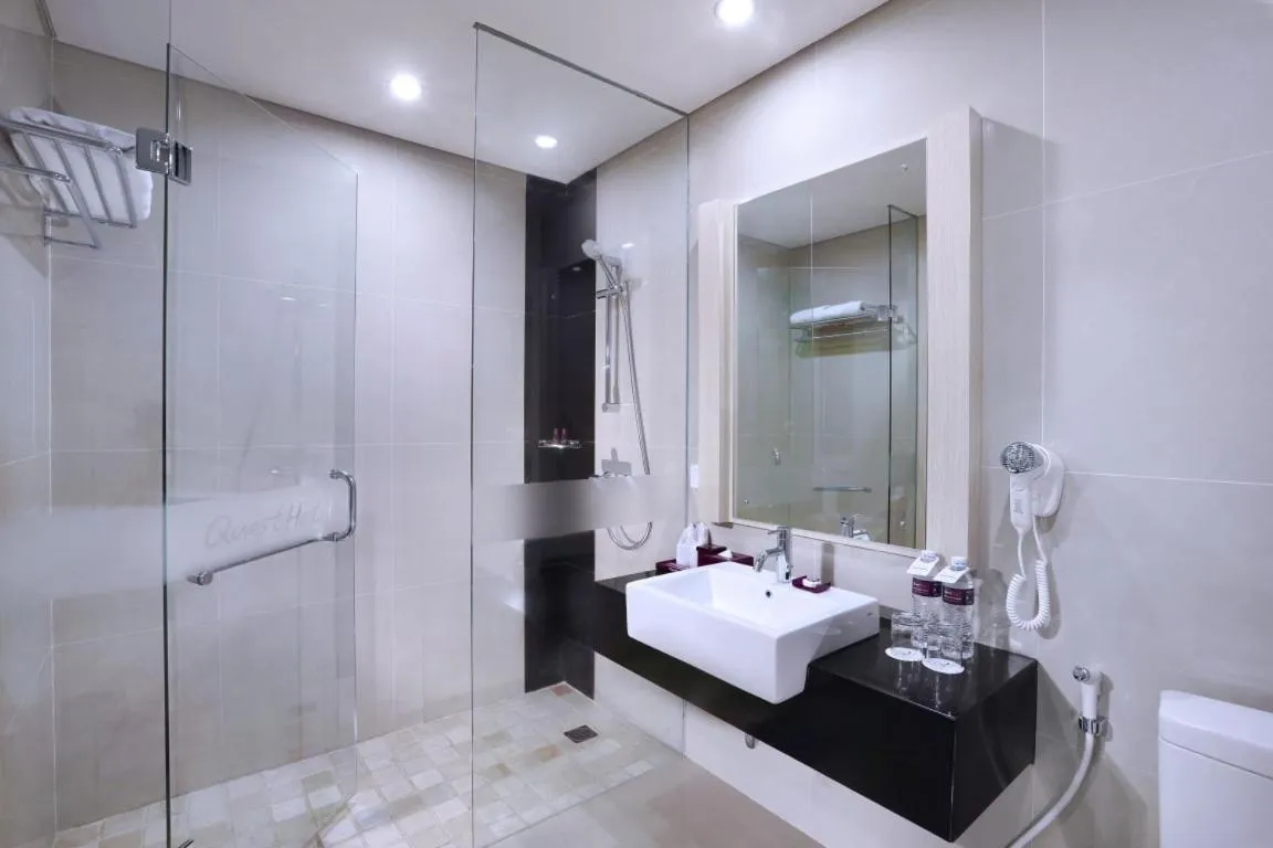 Bathroom in Quest San Denpasar by ASTON