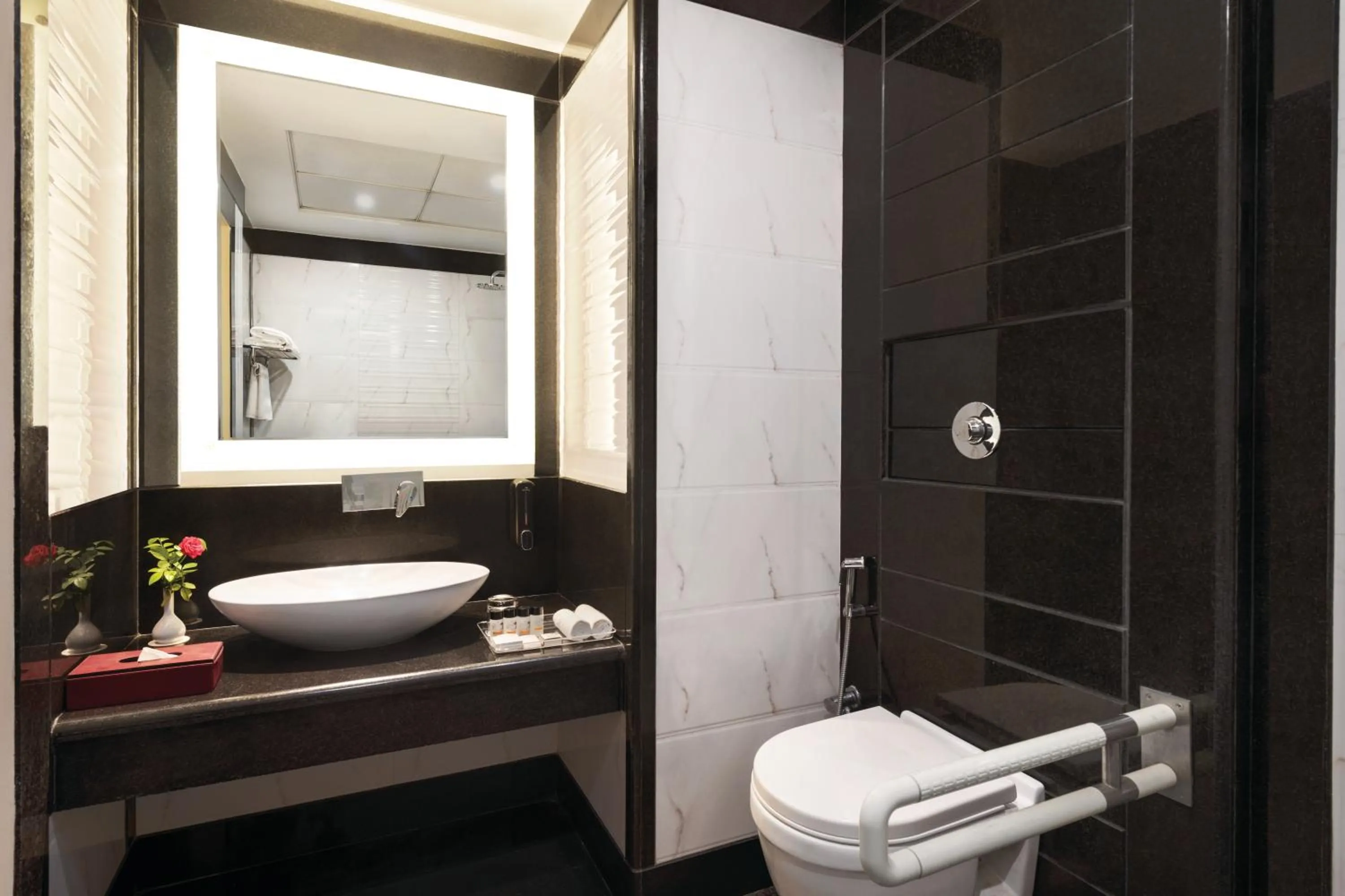 Bathroom in Ramada by Wyndham Varanasi Katesar