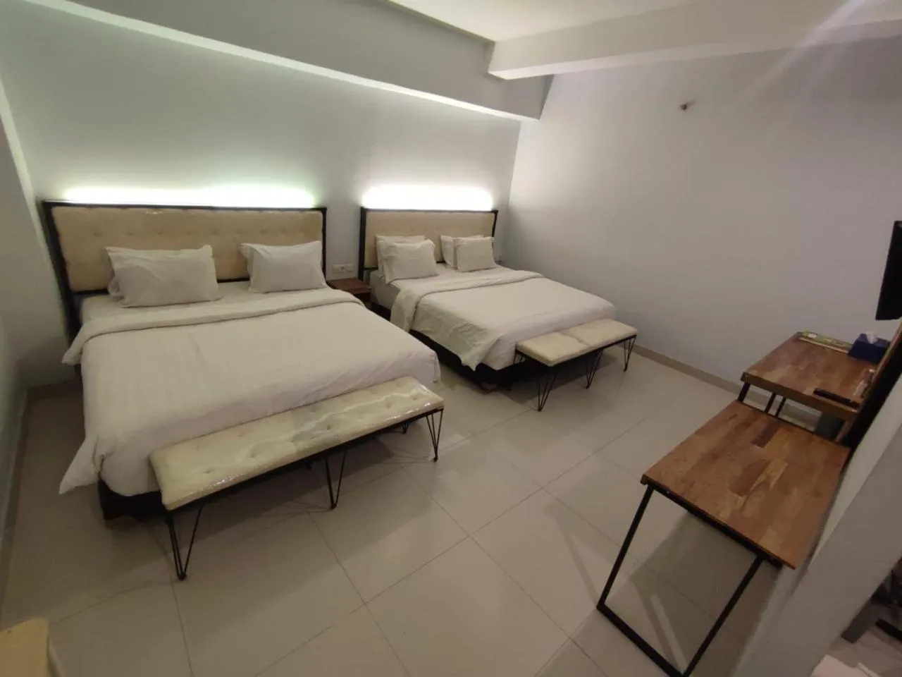 Bed in De La Charis Hotel by Waringin Hospitality