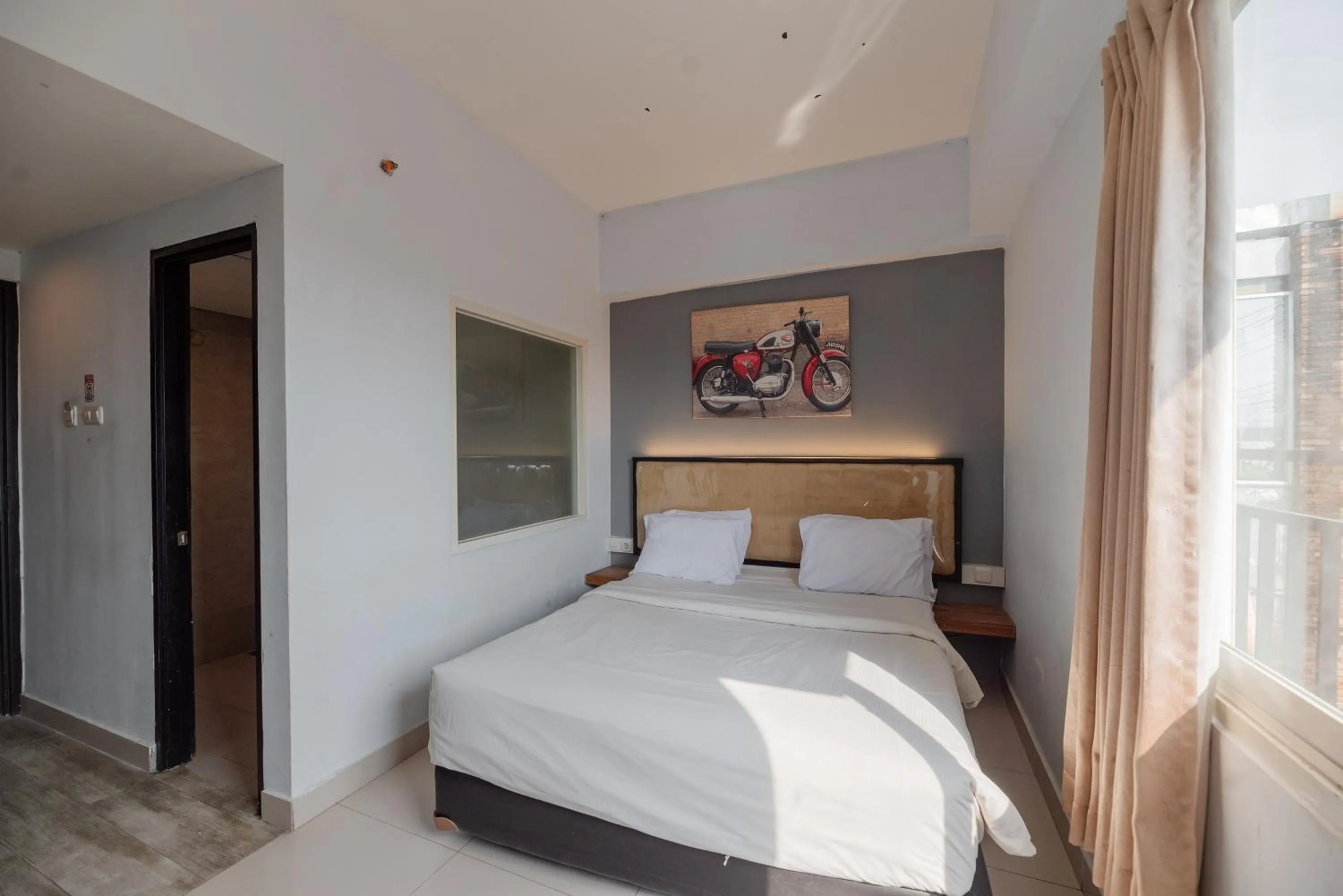 Bed in De La Charis Hotel by Waringin Hospitality