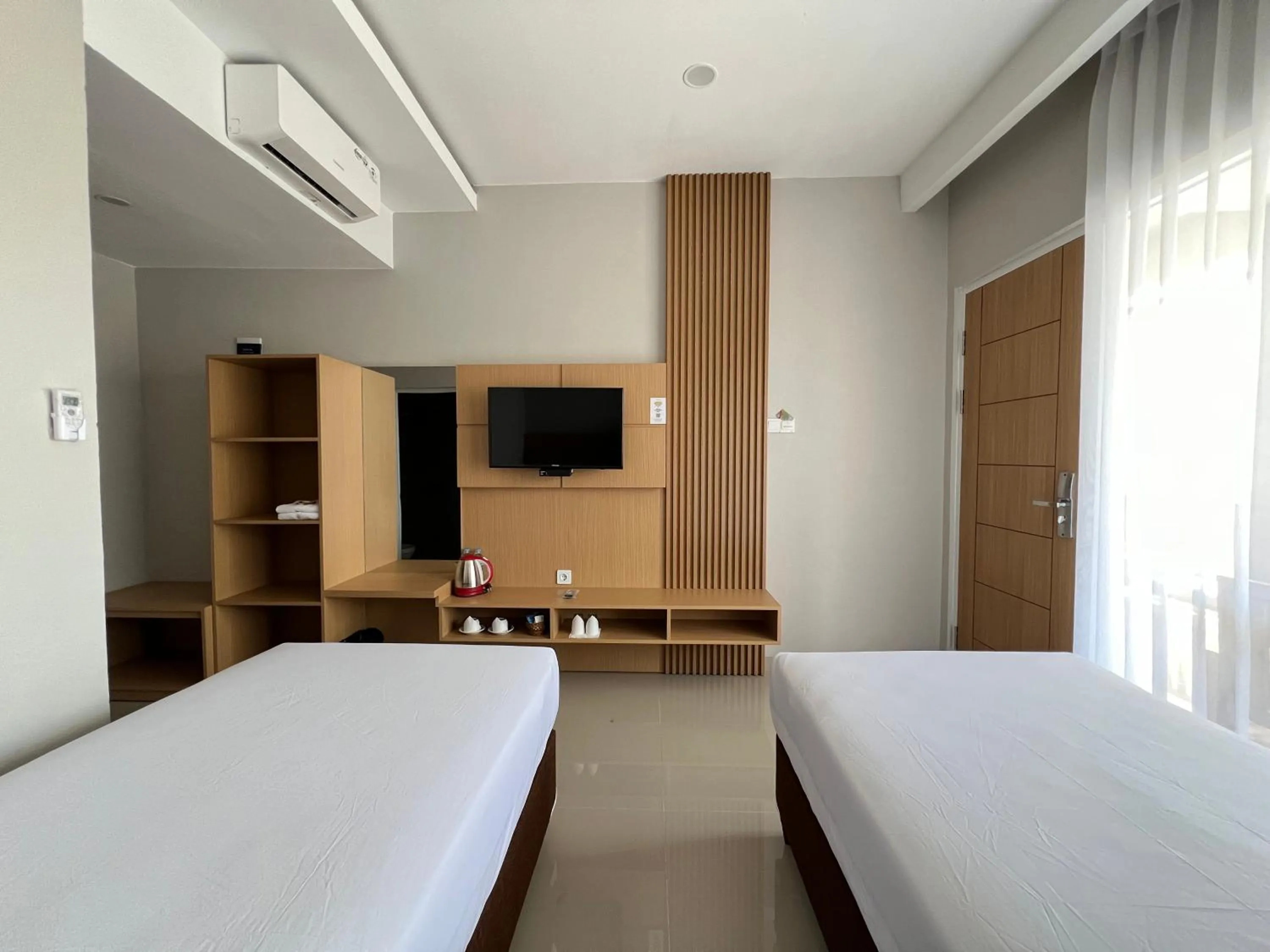 Communal lounge/ TV room, Bed in Hotel Century Pangandaran