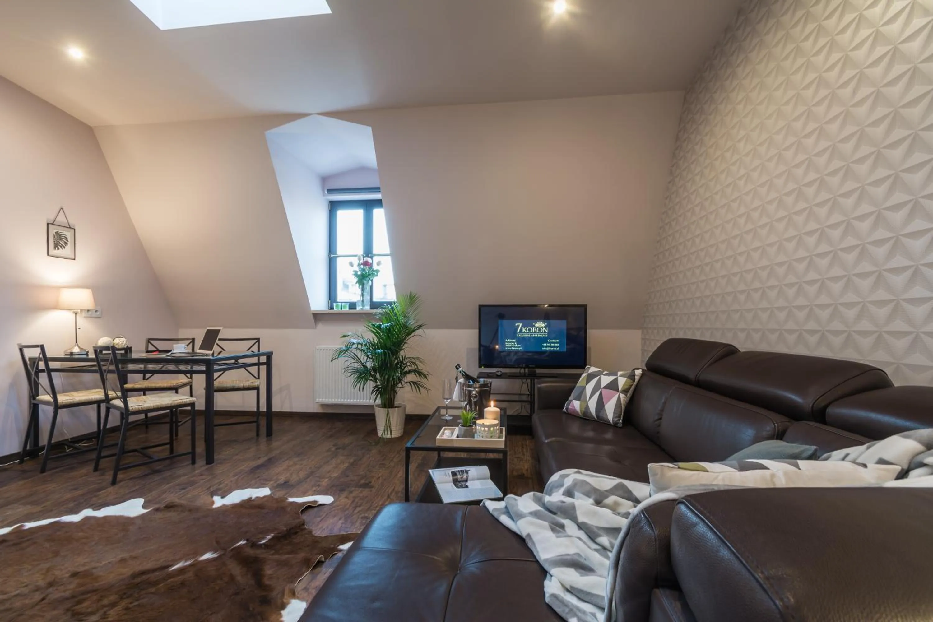 Property logo or sign in 7 Koron - Exclusive Apartments