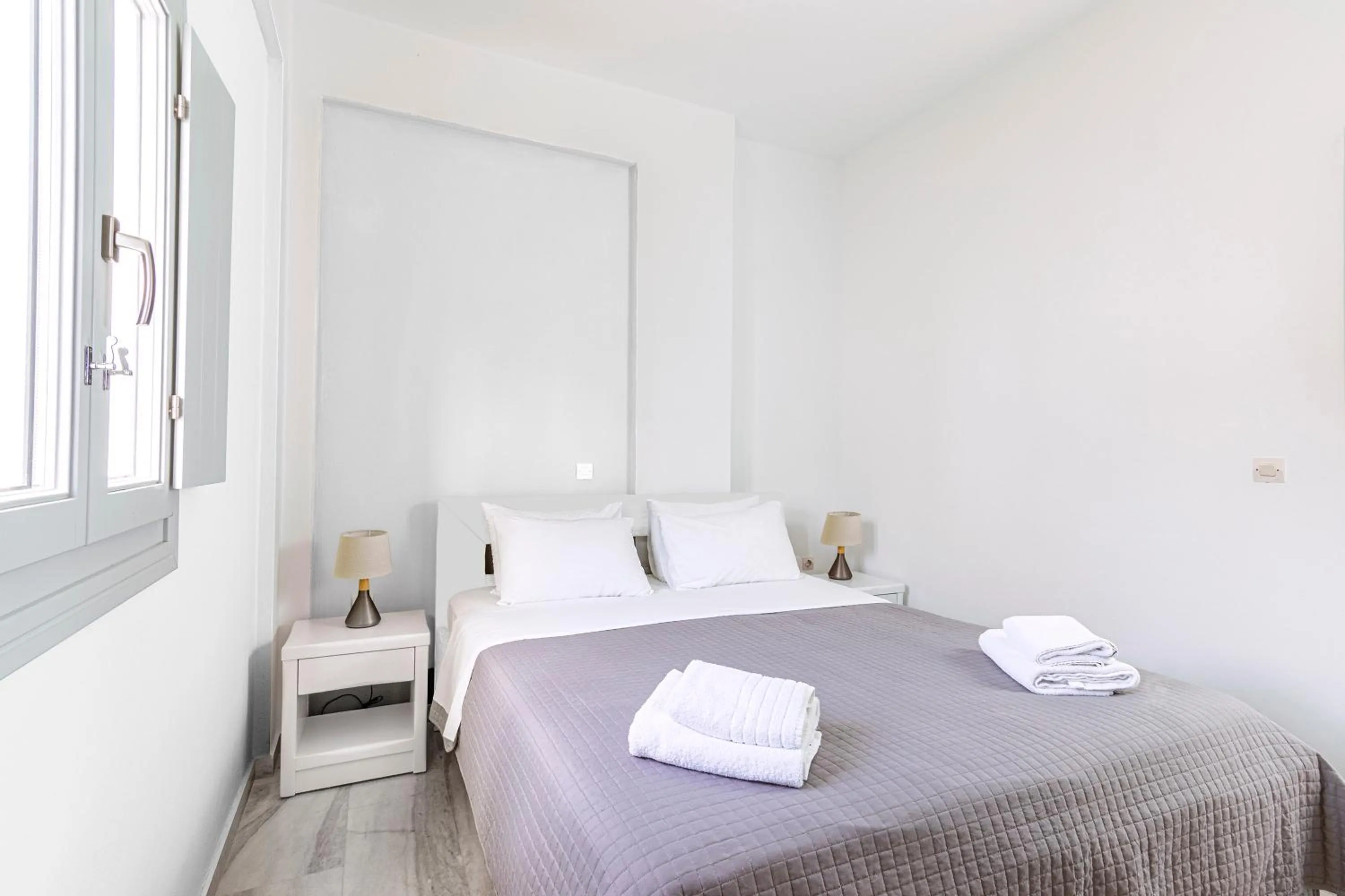 Bed in Phaos Santorini Suites