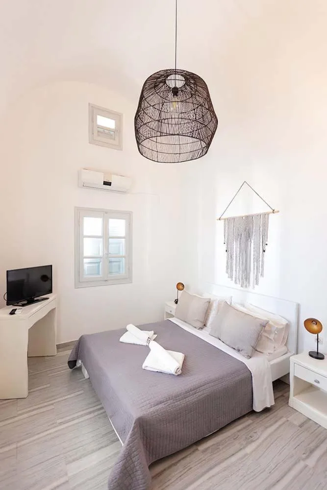 Bed in Phaos Santorini Suites