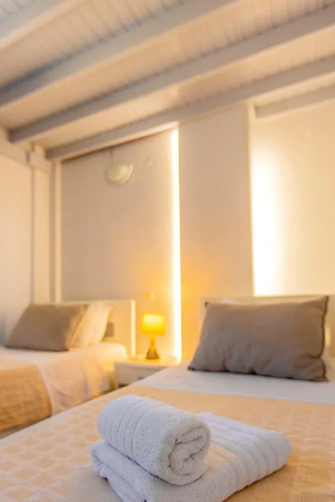 Bed in Phaos Santorini Suites