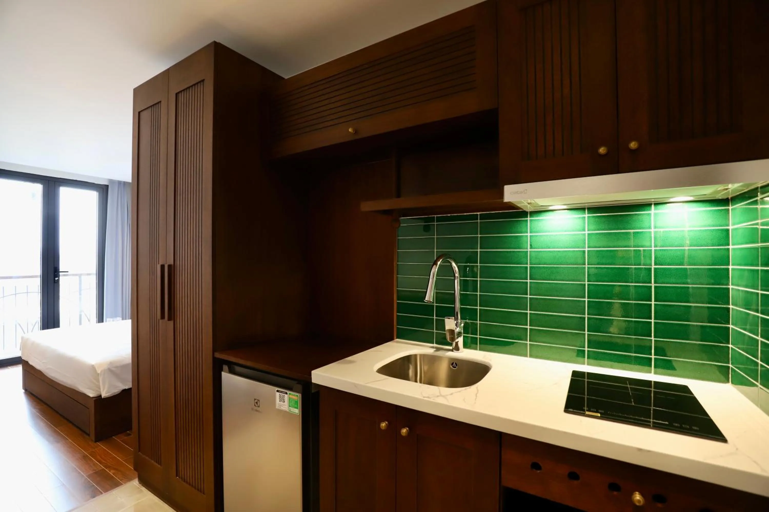 Kitchen or kitchenette, Bed in Maison Nha 16 Nguyen Khuyen