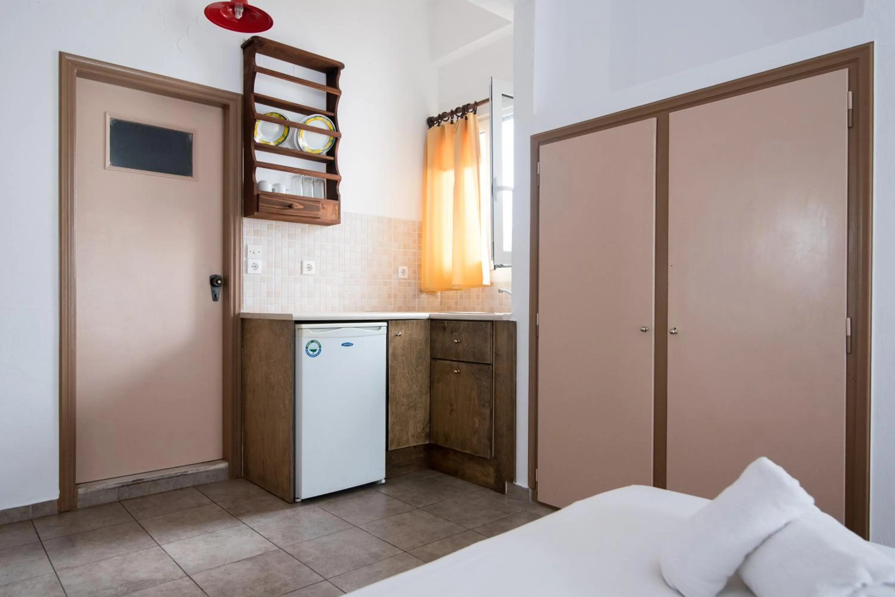 Kitchen or kitchenette, Bed in Ibiscus Hotel Malia