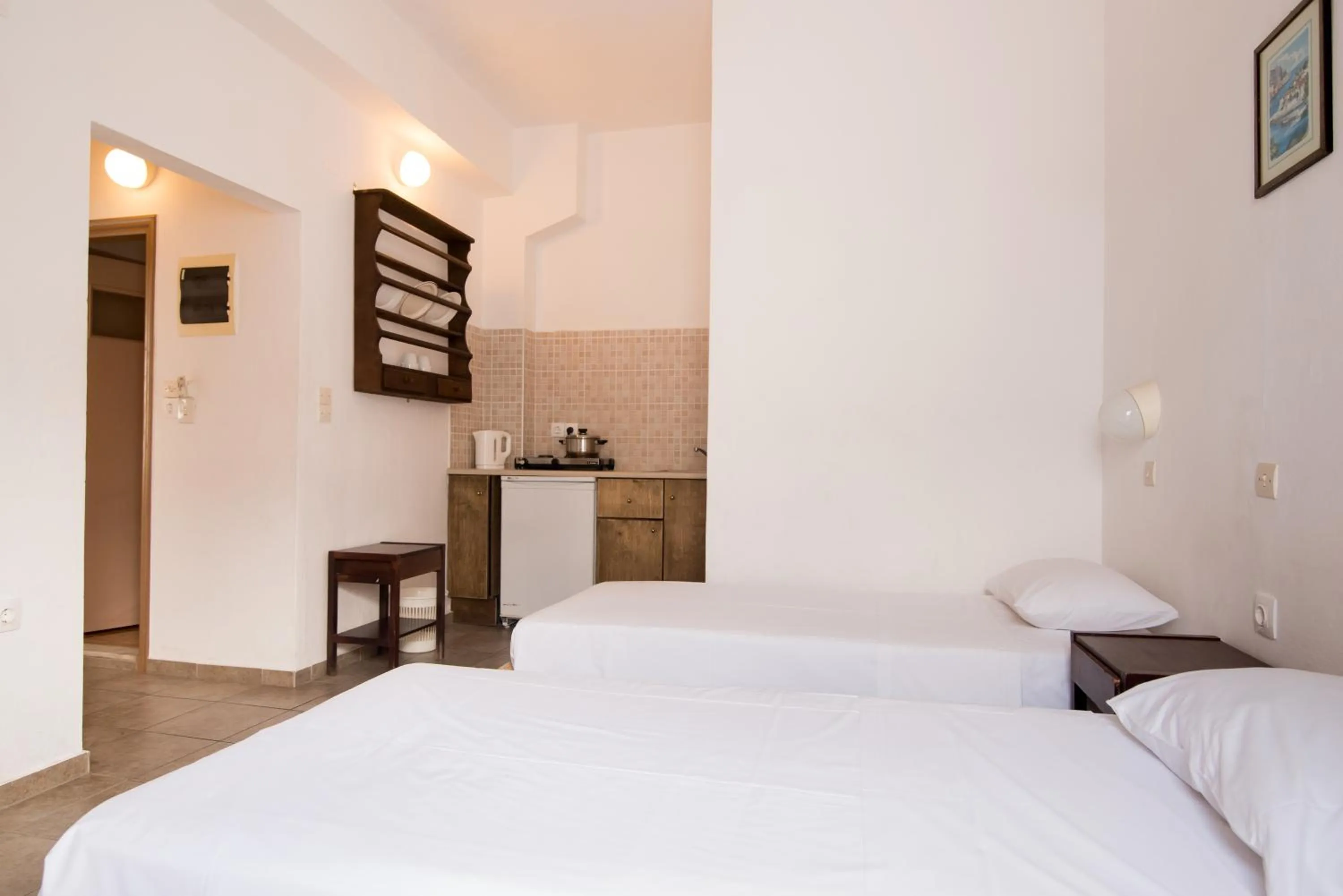 Kitchen or kitchenette, Bed in Ibiscus Hotel Malia