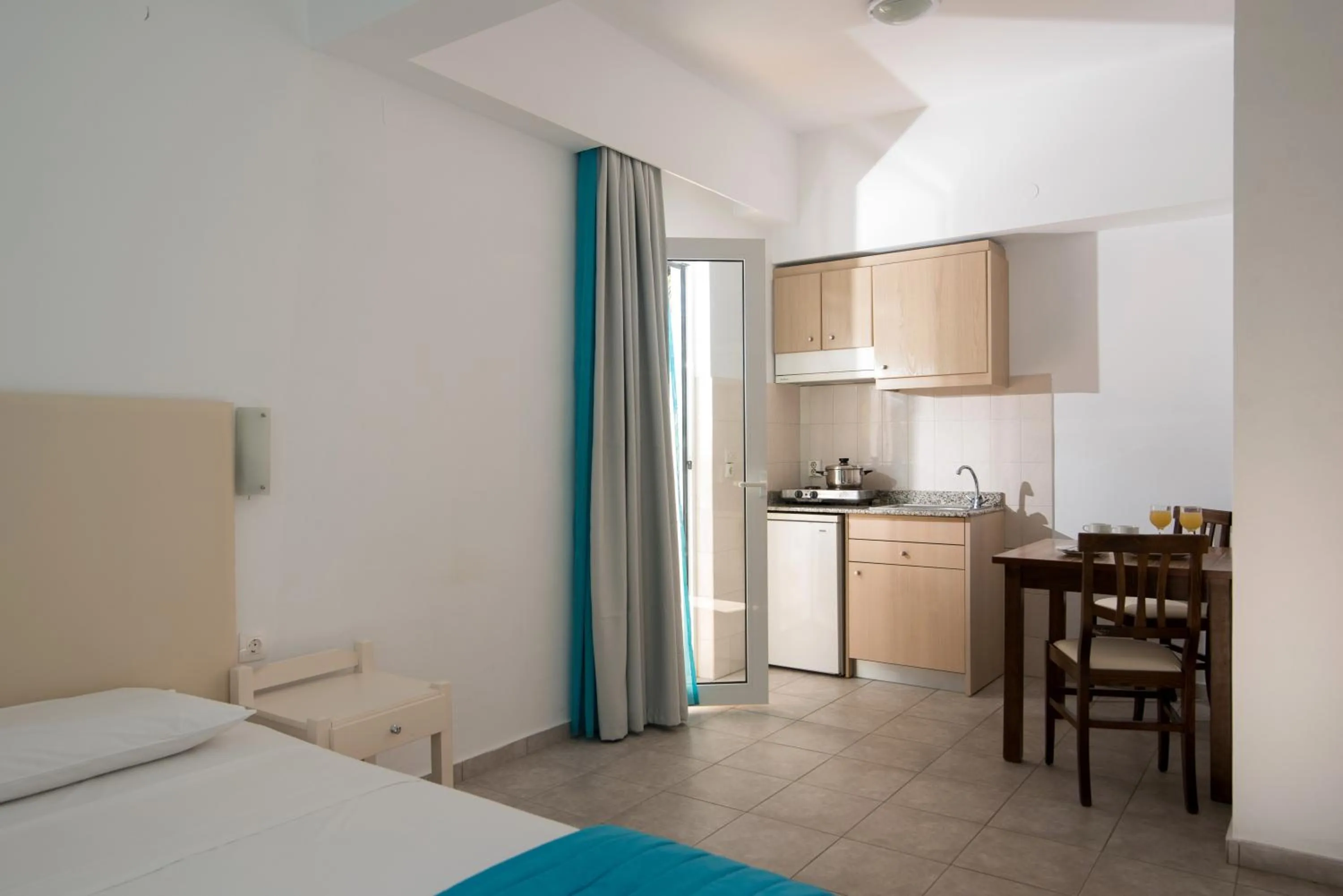 Kitchen or kitchenette, Bed in Ibiscus Hotel Malia