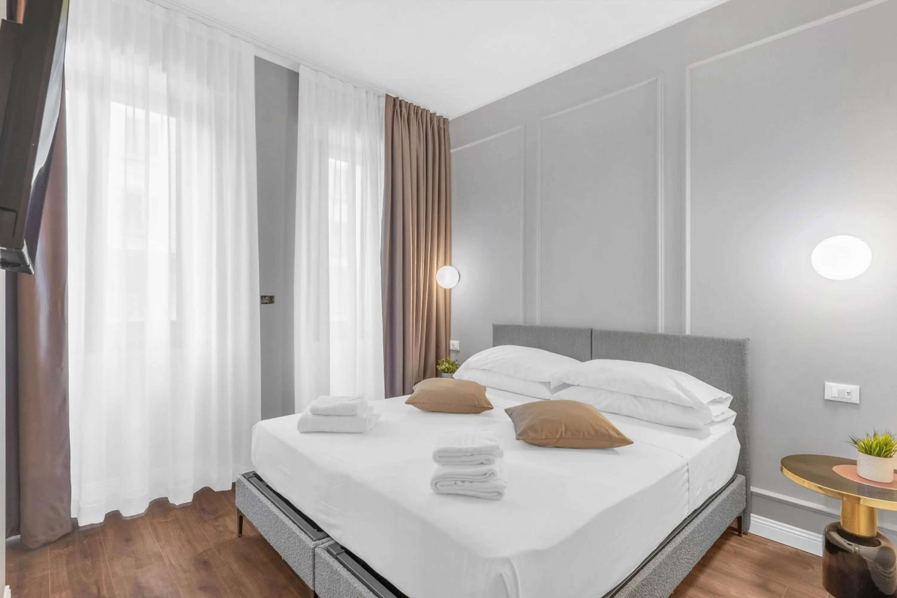 Bed in Torriani Suites Foresteria Lombarda