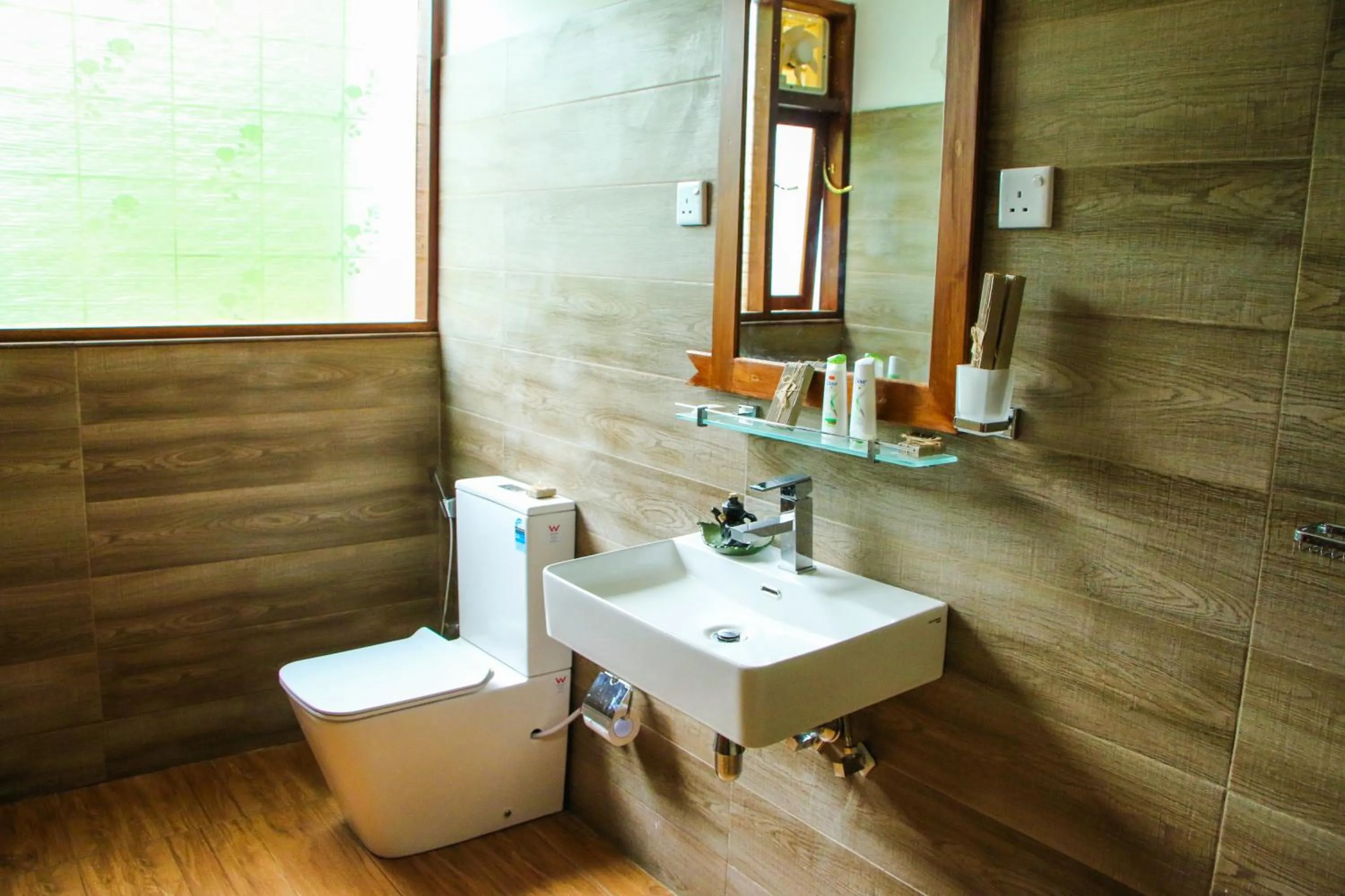 Toilet in EllaCrest by Aloft