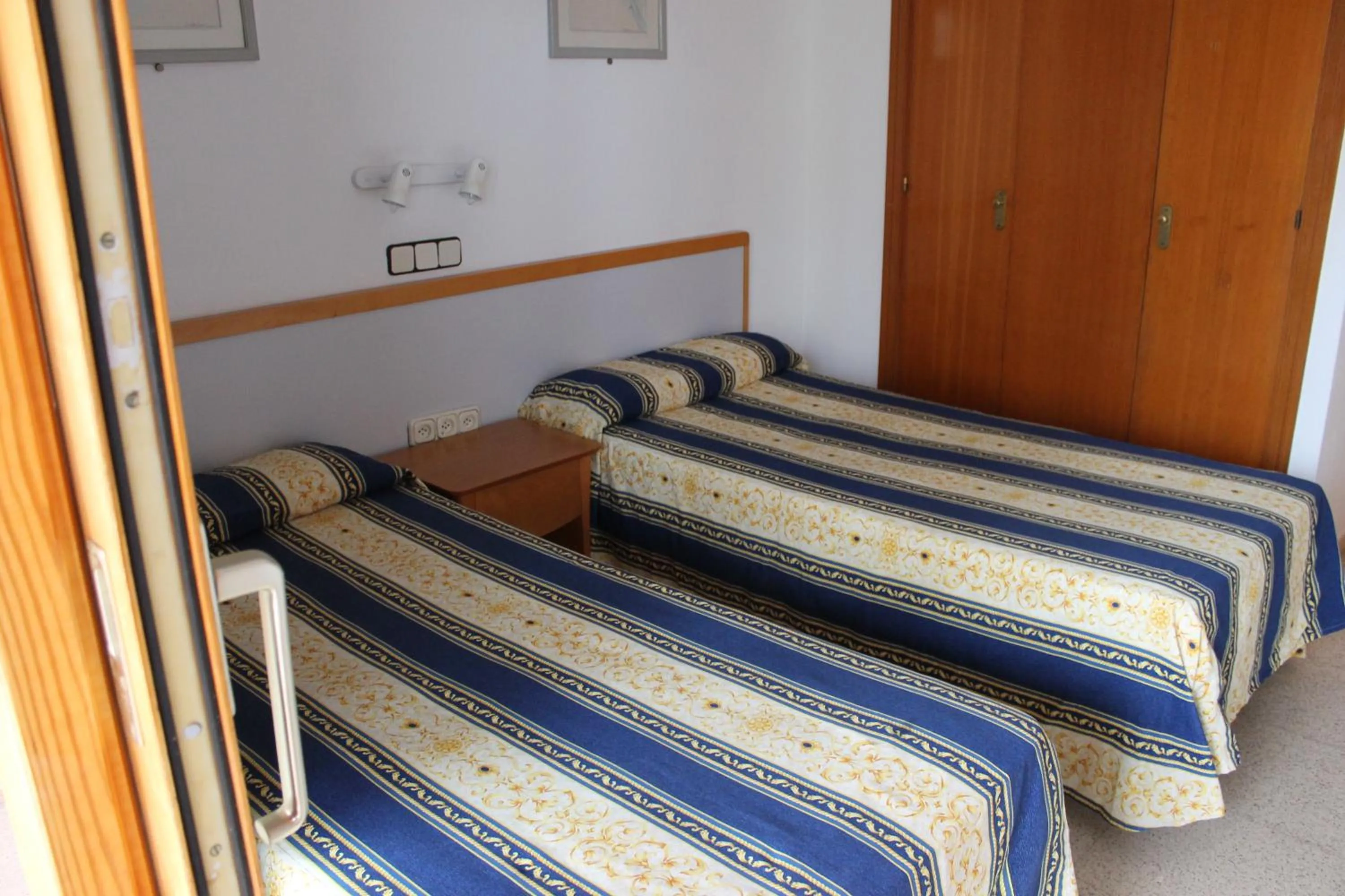 Bed in Apartamentos Alpha