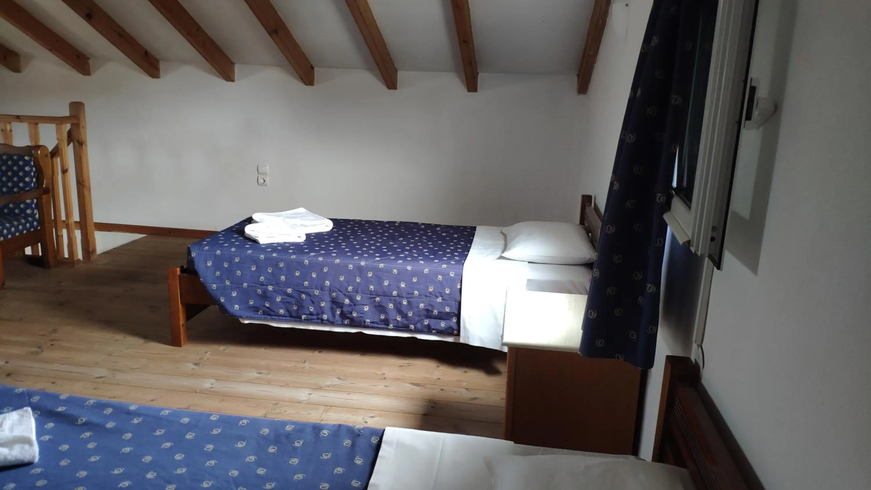 Bed in Tondoris Apartments