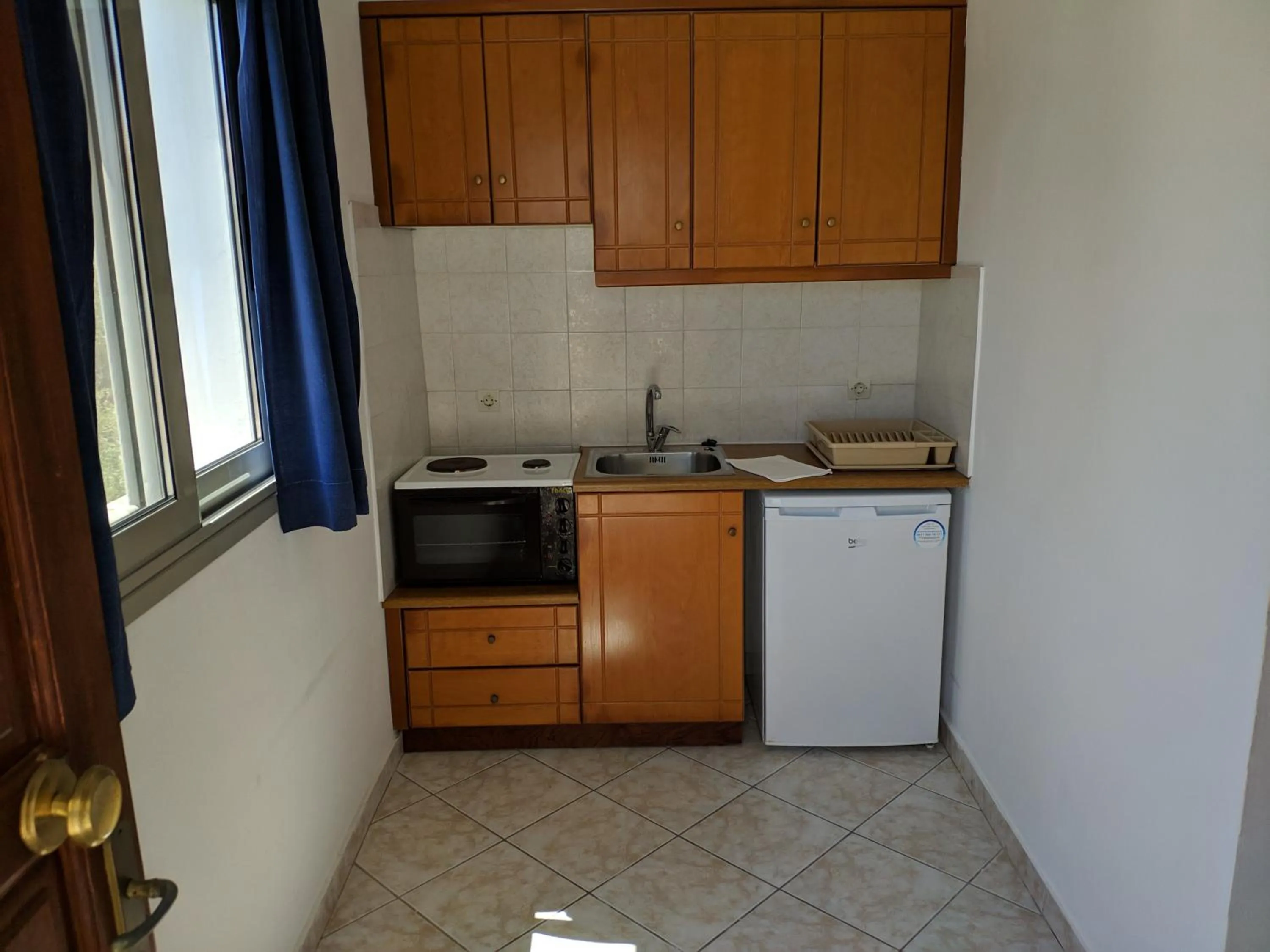 Kitchen or kitchenette in Tondoris Apartments
