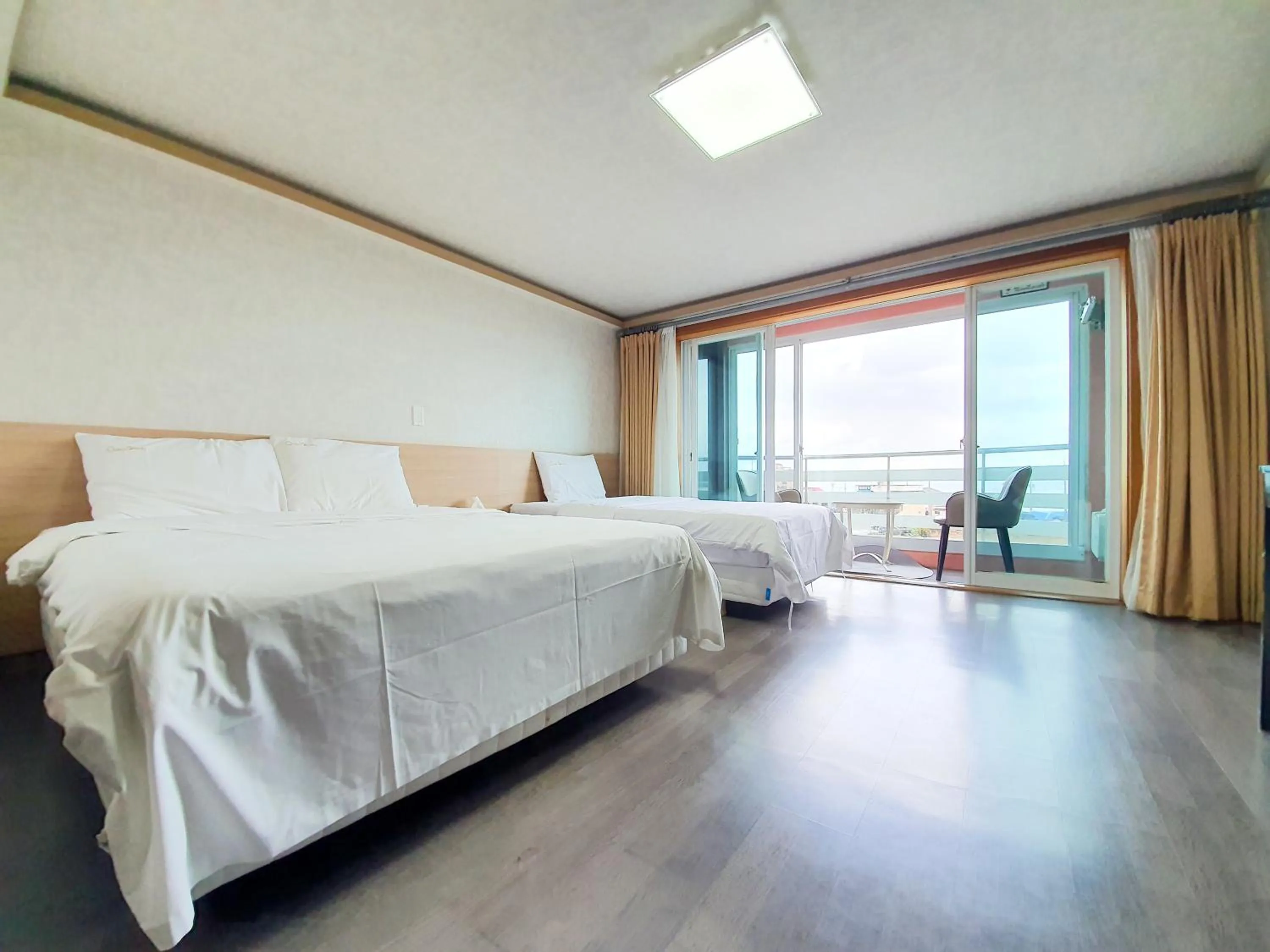 Bed in Jeju Ocean Family Hotel